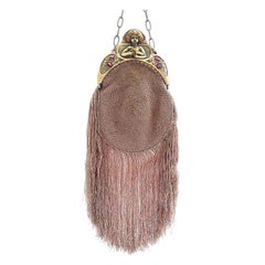 A celluloid frame and crocheted silk fringed handbag, with flapper motif, France