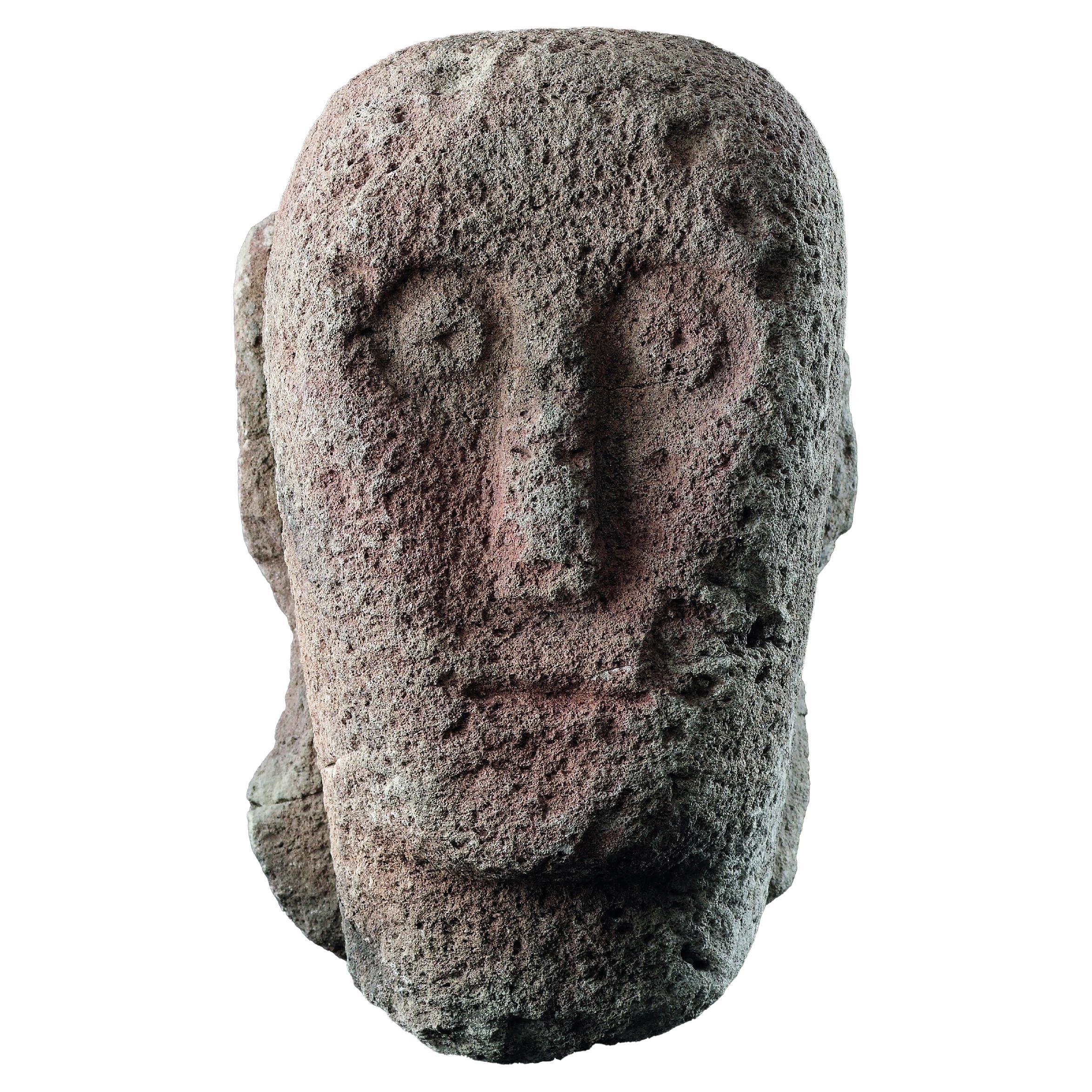 A Celtic Stone Head with ‘Staring’ Eyes, Long Nose and Slit Mouth