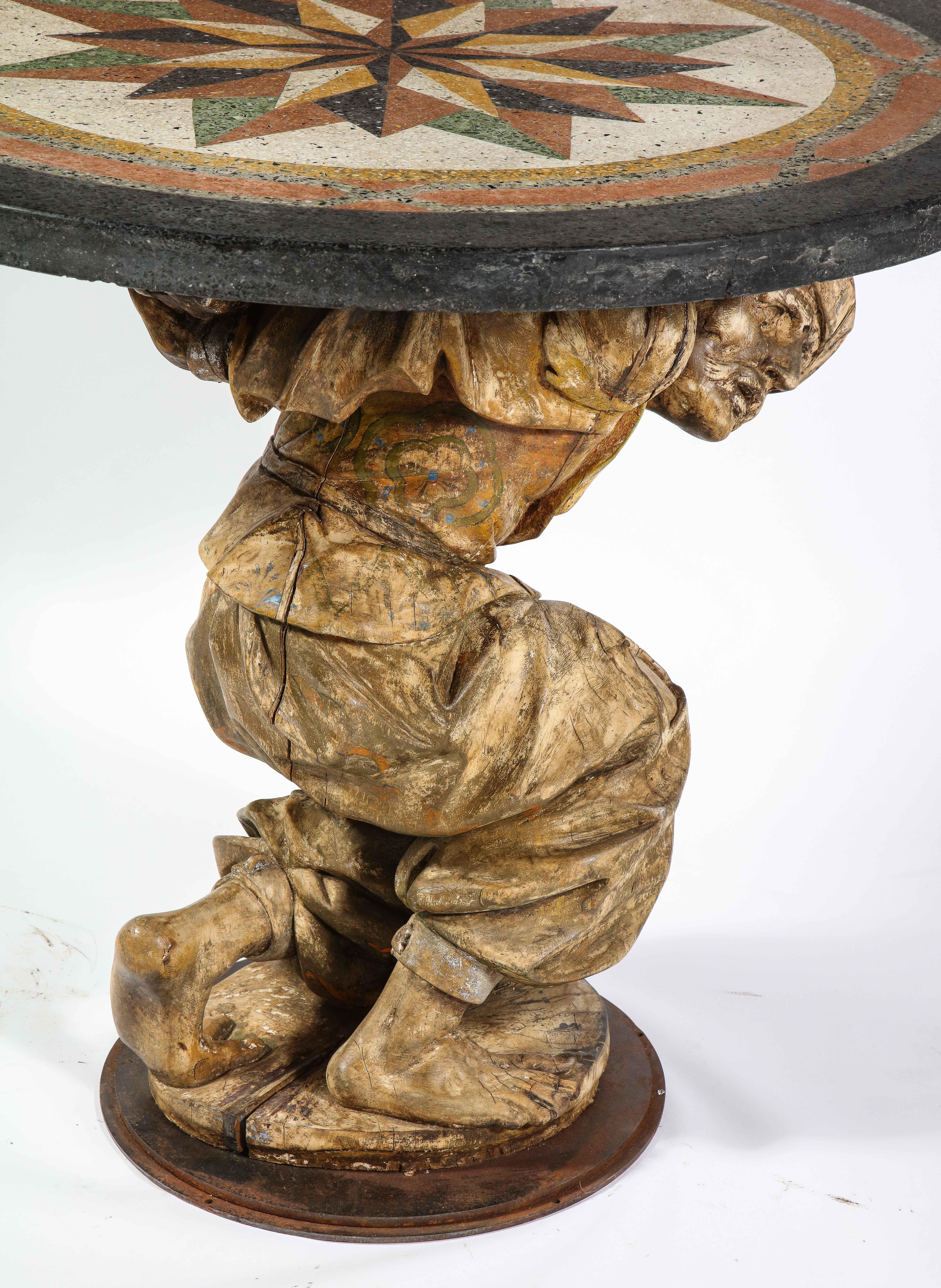 Marble Center Table of a Carved Wooden Roman Figure of a Man with a Pietra Dura Top For Sale