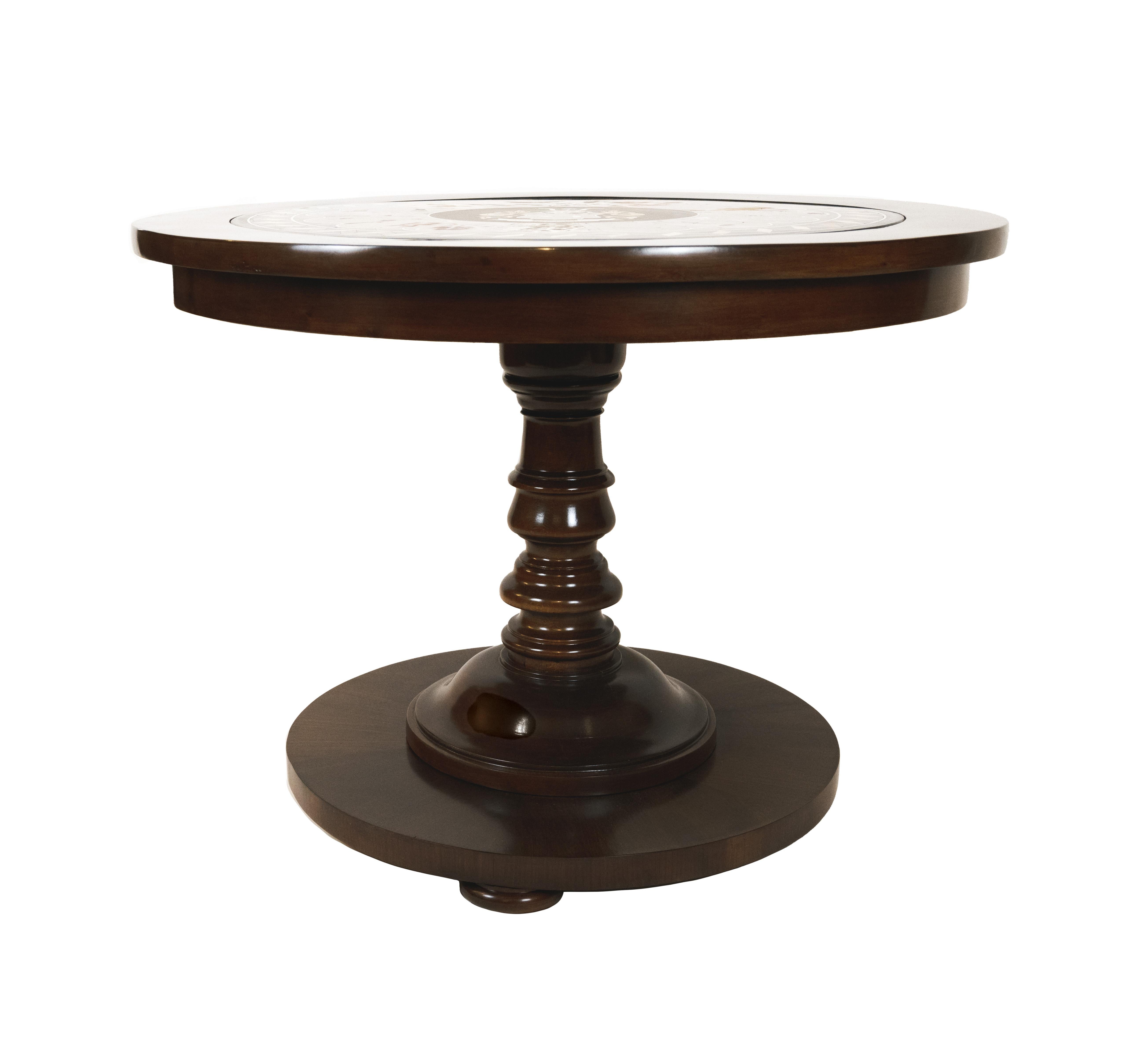 A 19th century center table with mahogany veneer. The pietra dura top with highly contrasted marble pieces depicting the van Wedekind family coat of arms with the motto 