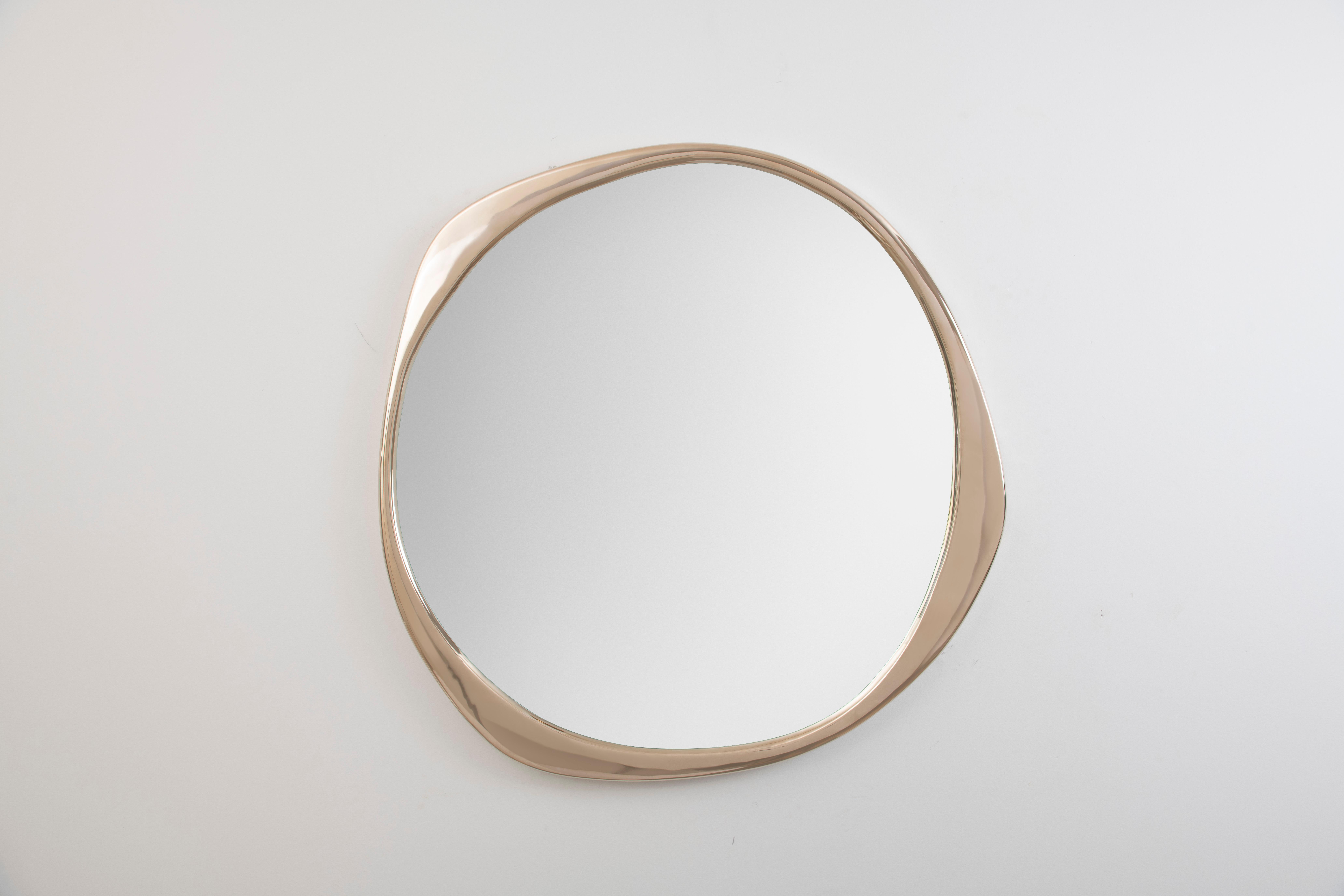 The sculptural A.Cepa Mirror in Polished Bronze is cast in bronze at a fine art foundry in Pennsylvania, and skillfully polished by hand. Undulating and irregular in form, the A. Cepa mirror is the focal point in any room with its captivating