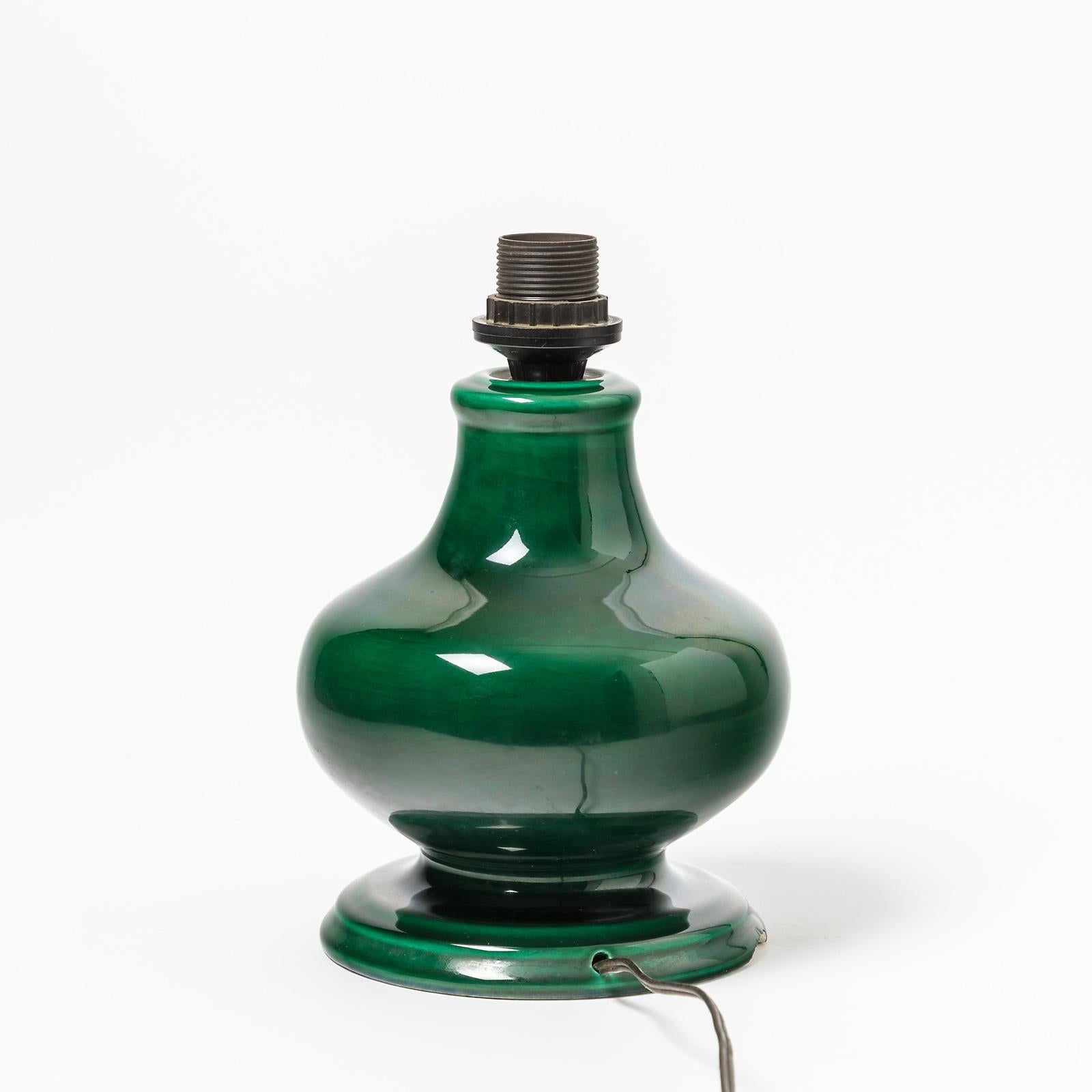 A ceramic lamp with green glaze decoration.
Vallauris, France.
Perfect original conditions,
circa 1960-1970.
Signed under the base XF.
Sold with a new European electrical system.
Dimensions are mentioned only for ceramic.
