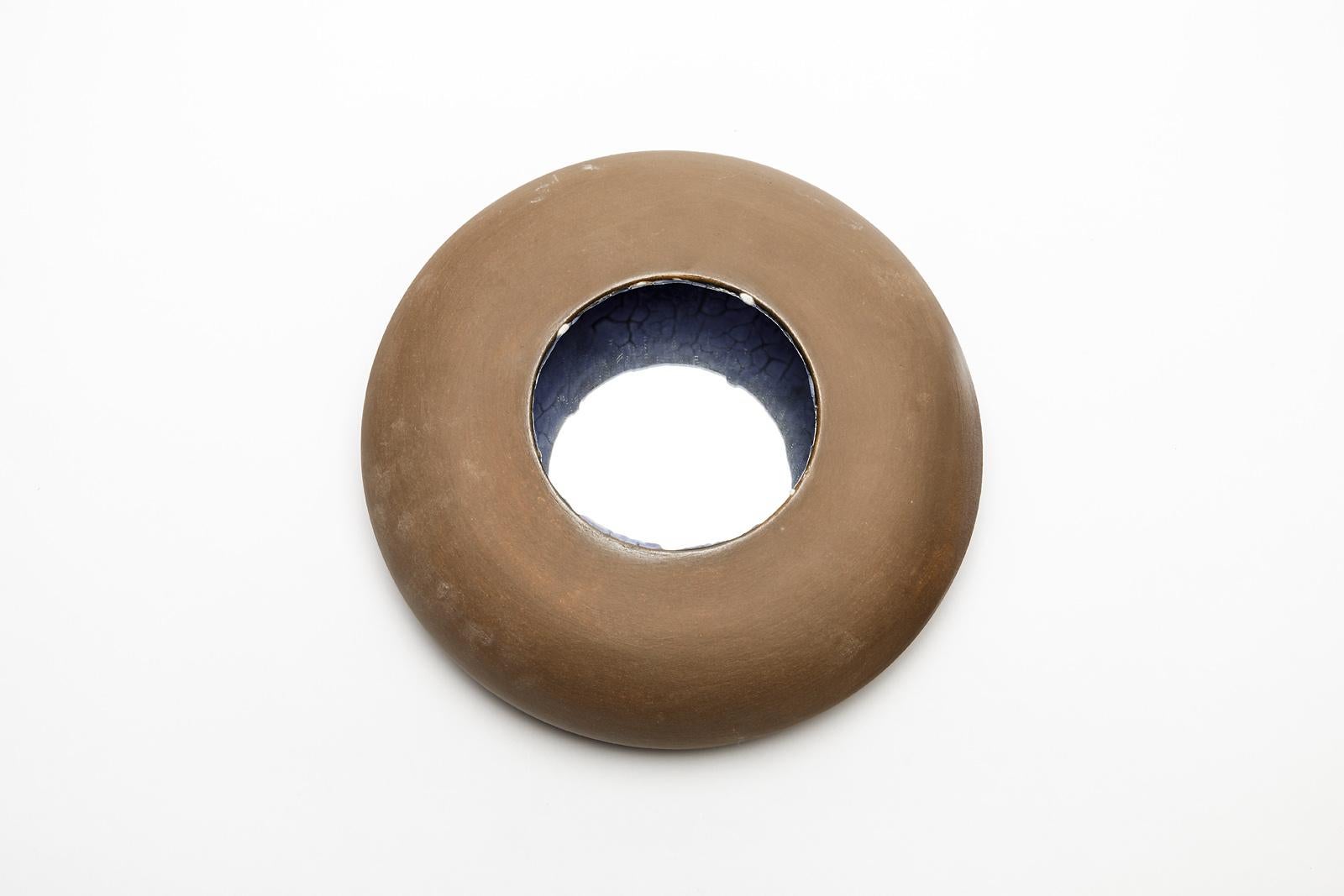 A ceramic mirror with brown and blue glazes decoration by Mia Jensen.
Unique piece.
Signed under the base.
Unique piece,
circa 2019.