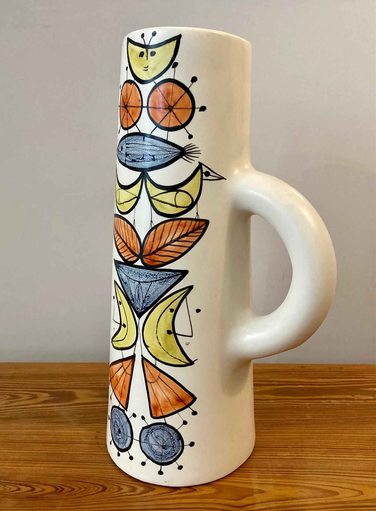 A large ceramic pitcher or jug, 
thick white enamel with polychrome decoration. 
Roger Capron,
 Vallauris 
France circa 1960.
signed 