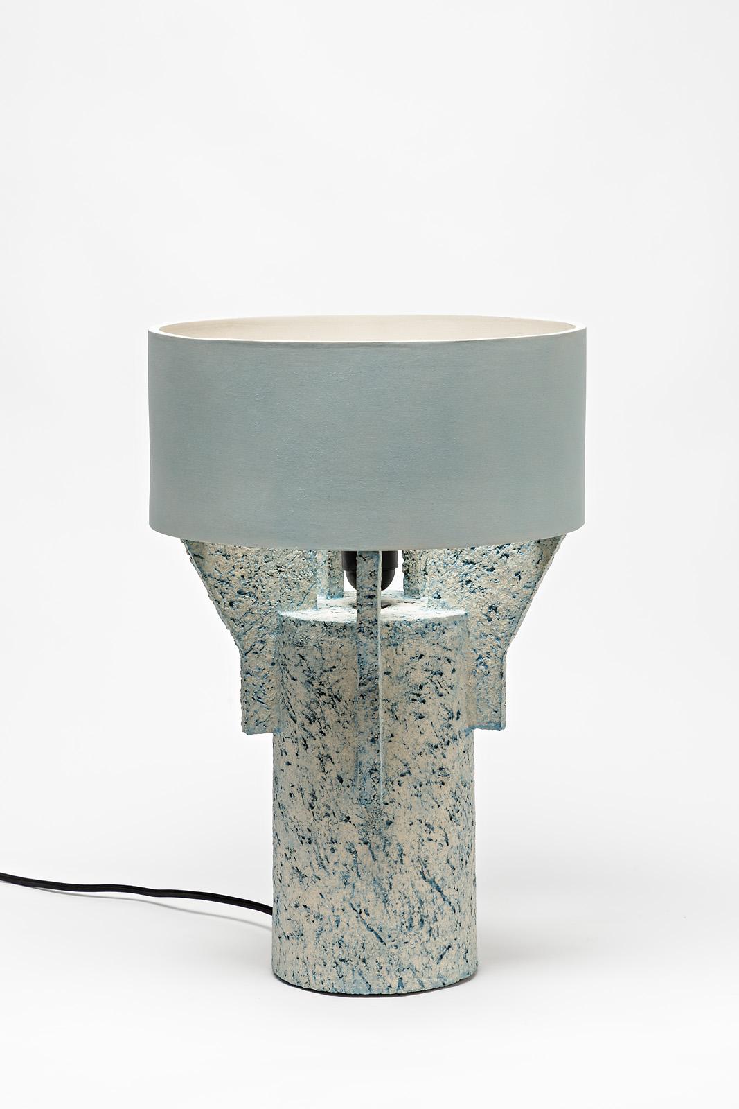 A ceramic table lamp by Denis Castaing with blue glaze decoration.
The base and the lamp shade are in ceramic.
Sold with an European electrical system.
Perfect original conditions.
2019.
Signed under the base.