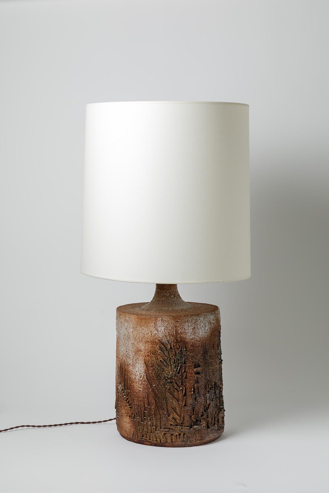 A ceramic table lamp with brown glaze decoration by Huguette & Marius Bessone.
Sold with a new lamp shaded new european electrical system
Perfect original conditions.
Signed under the base.
Circa 1970- 1980.

Dimensions :
- Ceramic only : 40 x 25, 5