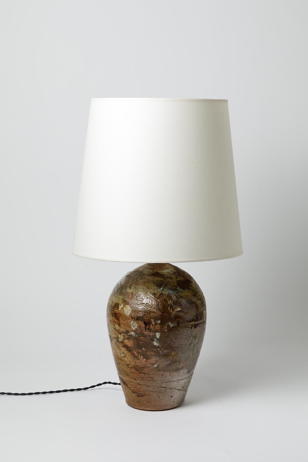 A ceramic table lamp with white glaze decoration by La Borne Potters.
Sold with a new lamp shade and a new european electrical system
Perfect original conditions.
Signed under the base.
Circa 1970- 1980.
Dimensions :
- Ceramic only : 33 x 21