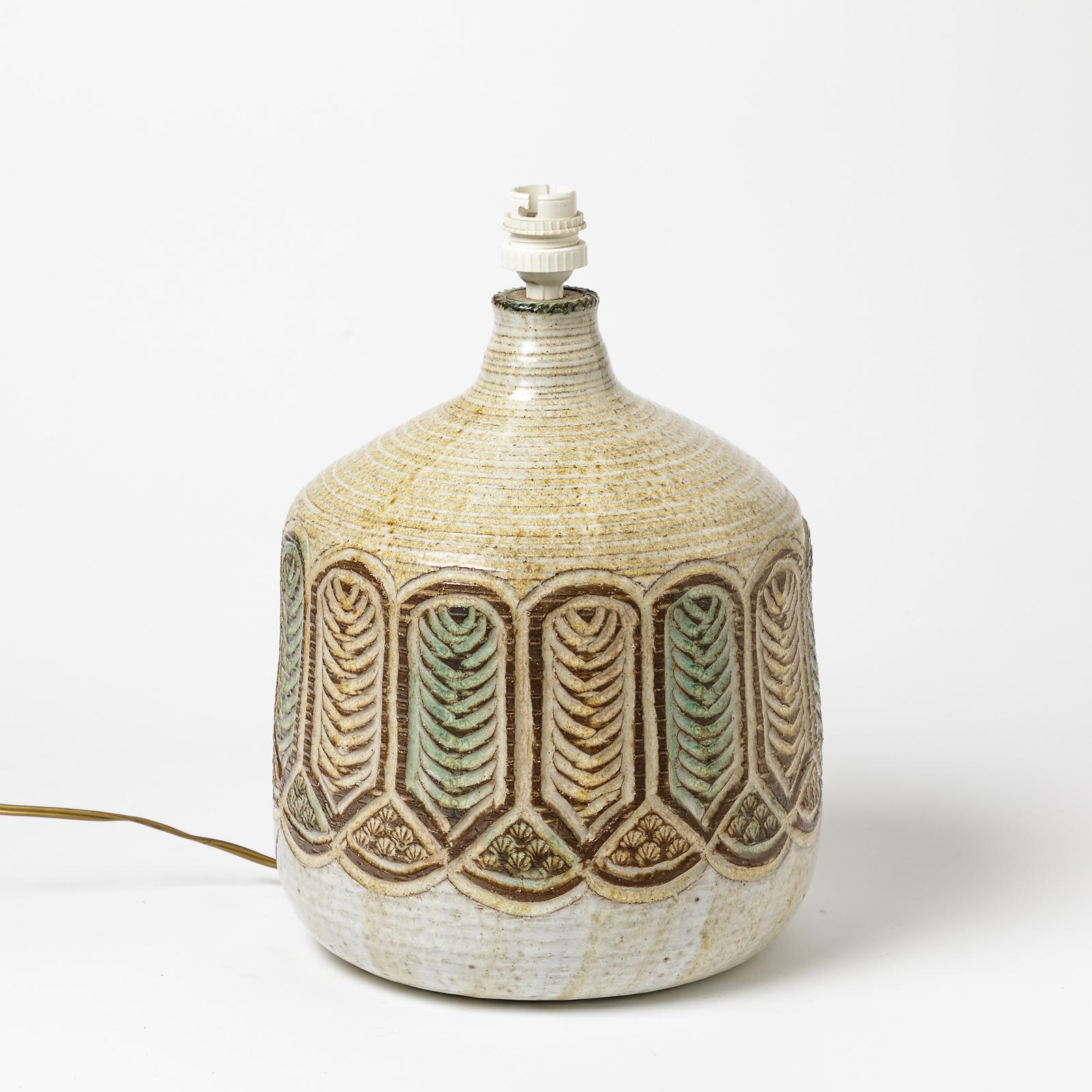 A ceramic table lamp by Marcel Giraud, with glaze decoration.
Signed under the base 