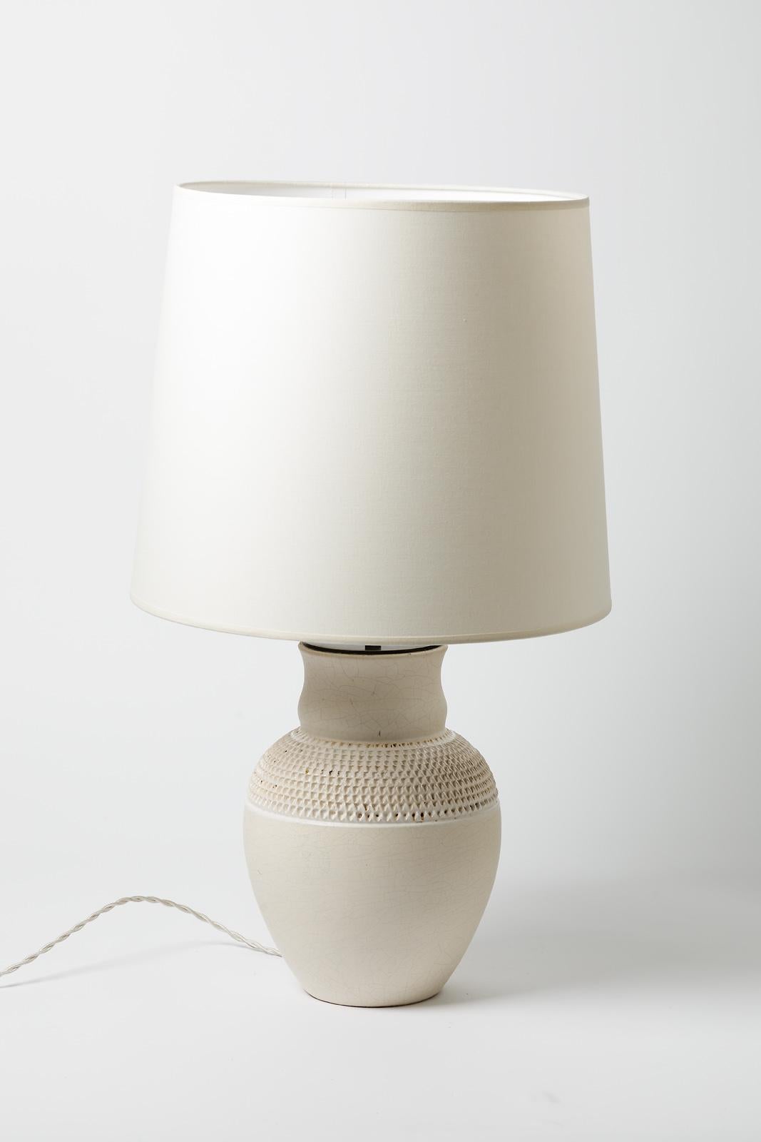 A ceramic table lamp with white glaze decoration by Pol Chambost.
Sold with a new lamp shaded new european electrical system
Perfect original conditions.
Signed under the base 