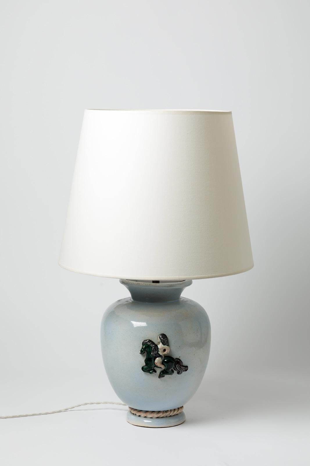 Blue glazed ceramic table lamp by Pol Pouchol. 
Sold with a new lamp shade and a new european electrical system
Perfect original conditions.
Stamp signature under the base like a sun.
Circa 1940-1950.

Dimensions :
- Ceramic only : 30 x 22 cm / 11.8
