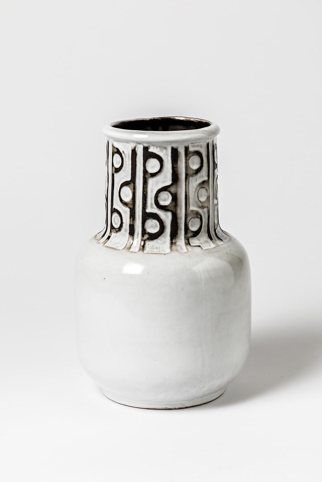 A ceramic vase with black and white glazes decoration.
Signed under the base 