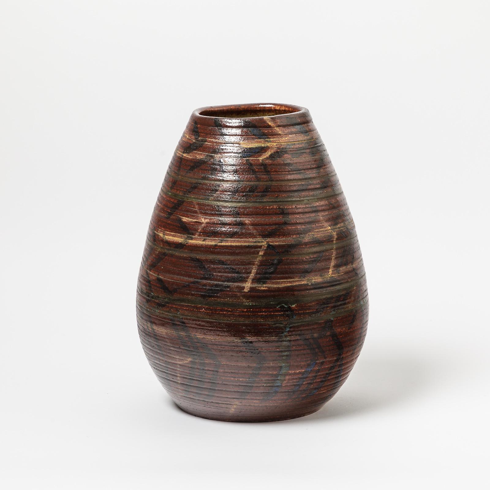A ceramic vase with glazes and geometrical decoration by Accolay.
Signed under the base 