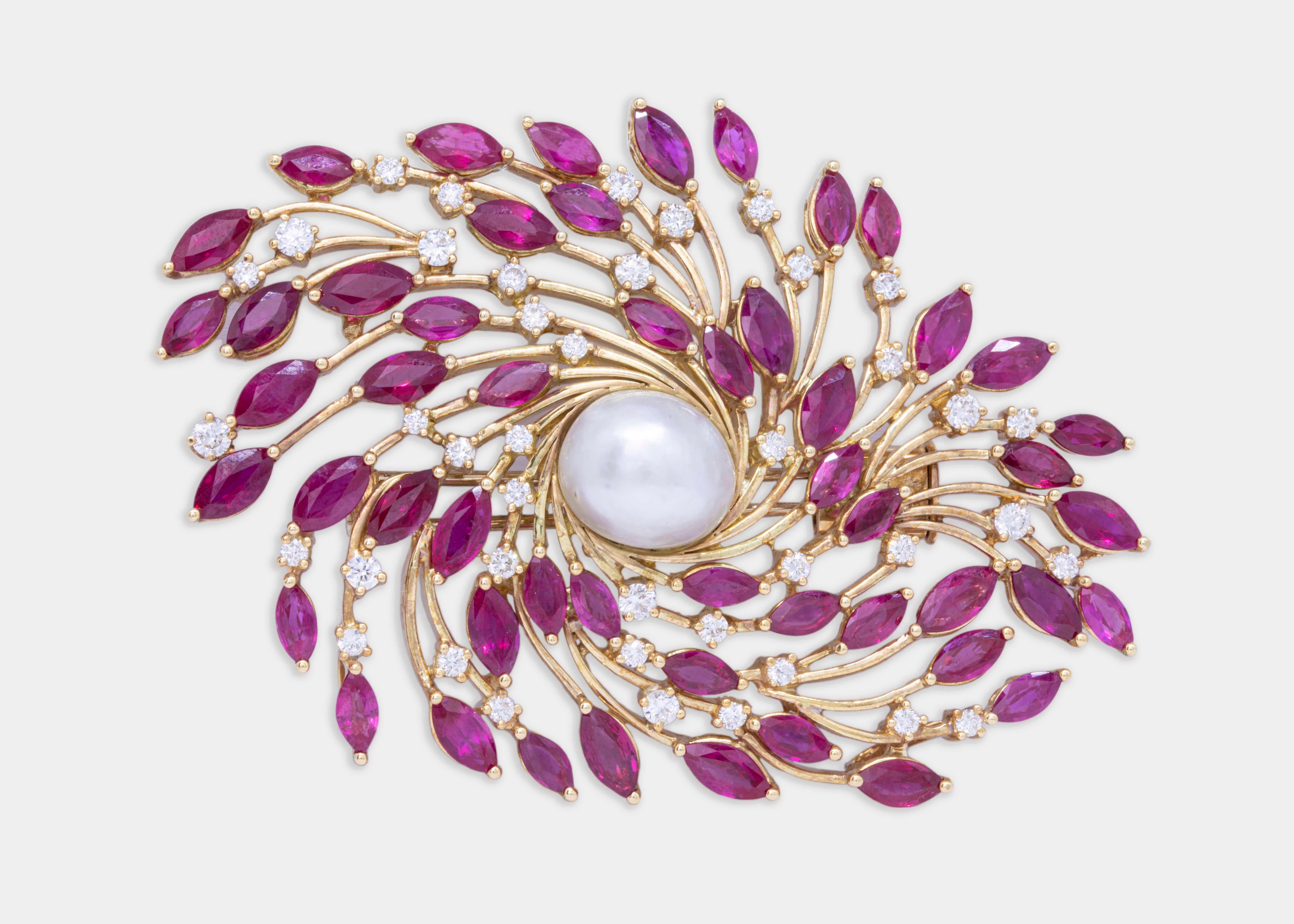 A one of its kind brooch inspired by whirling Dervishes. 

The 18k yellow gold swirls are centred with a natural Bahraini pearl button weighing 9.68 ct. with a diameter of 12.35 mm.

The pearl is surrounded with marquise shaped rubies and round VS1