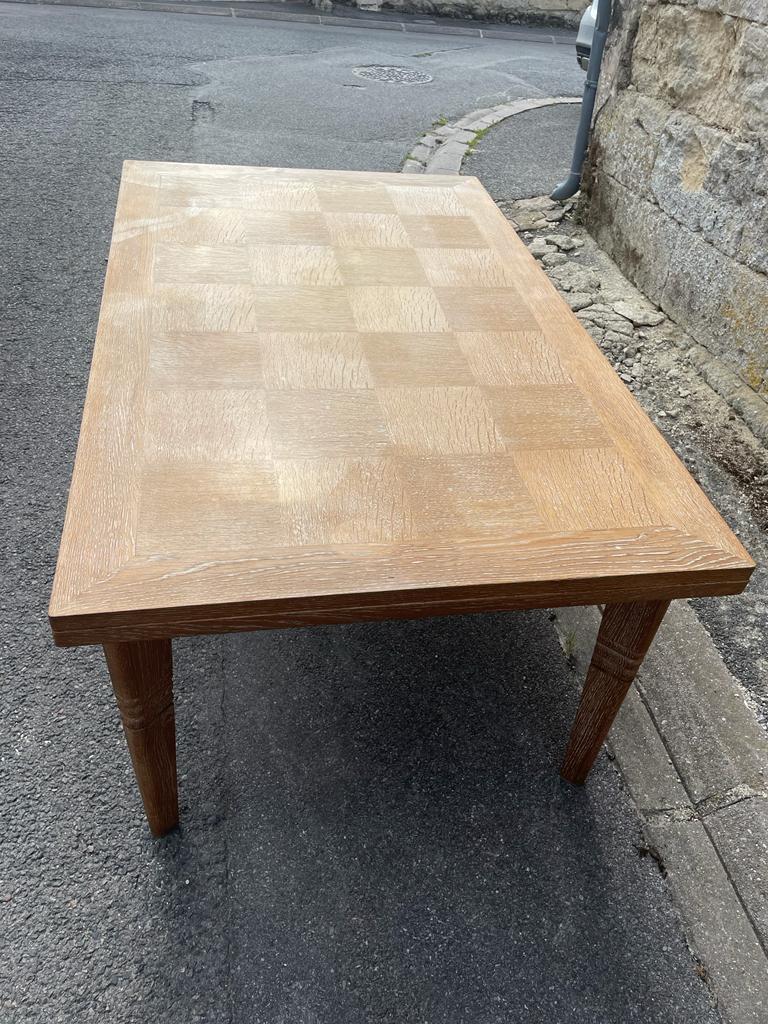 A 1940 cerused oak table by Charles Dudouyt
160cm closed and 243 with 2 matching leaves.
