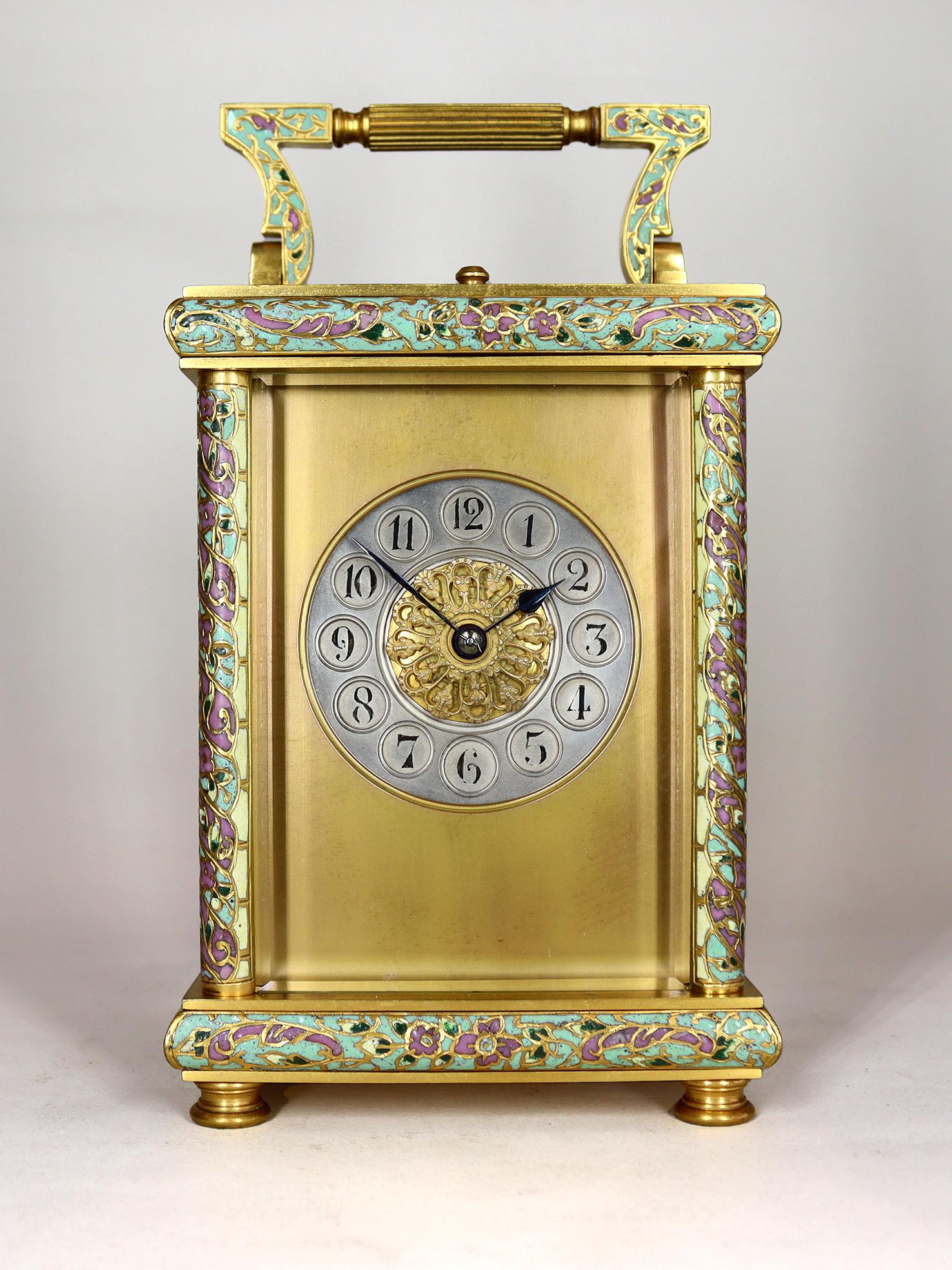A charming repeating carriage clock in champleve enamel case by one of the great Parisian makers. This eight day two train movement with an English lever platform escapement striking on a blued steel gong with silvered Arabic dial and gilded mask is