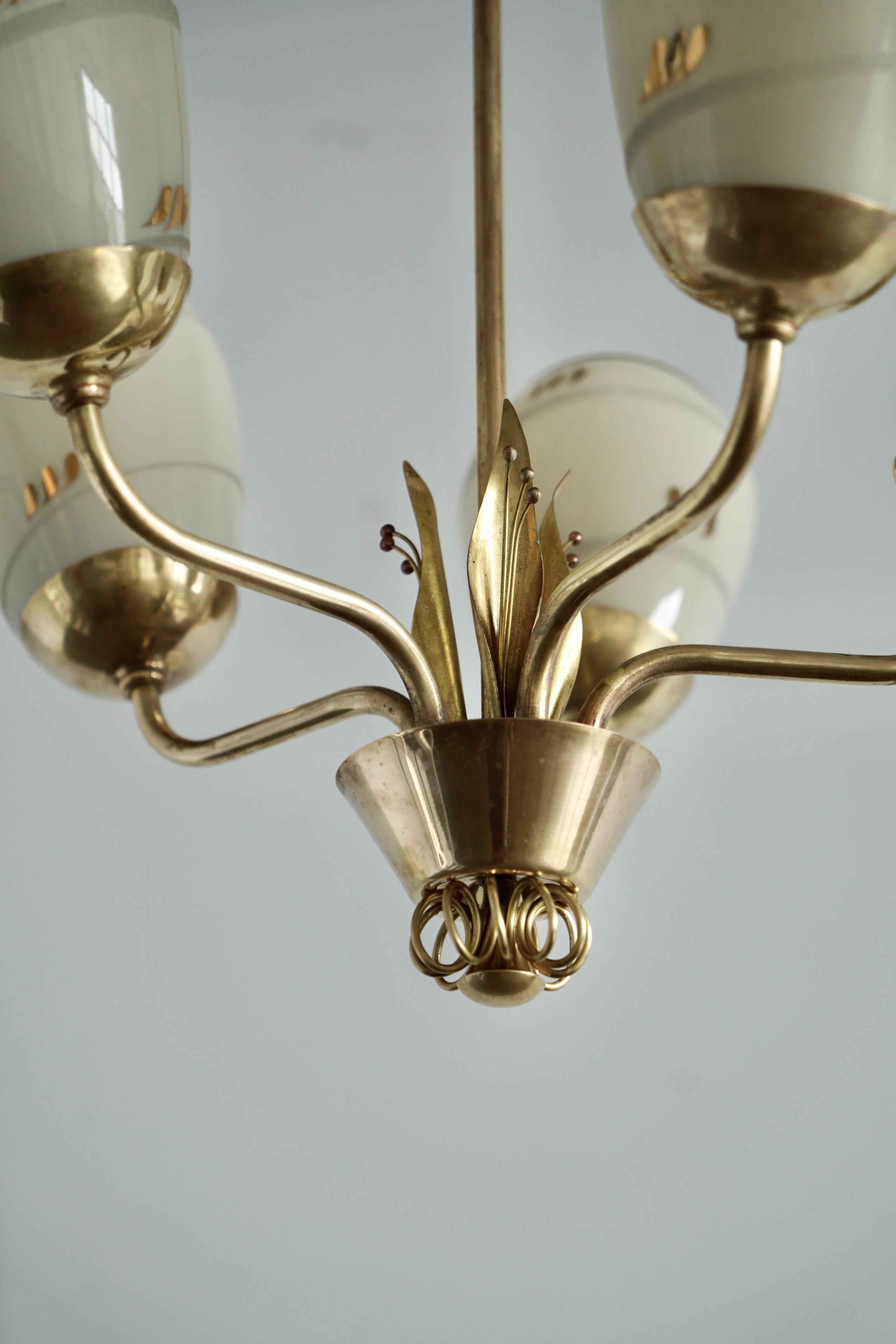 A chandelier design attributed to Paavo Tynell, Produced by Idman Oy In Good Condition For Sale In Long Island City, NY