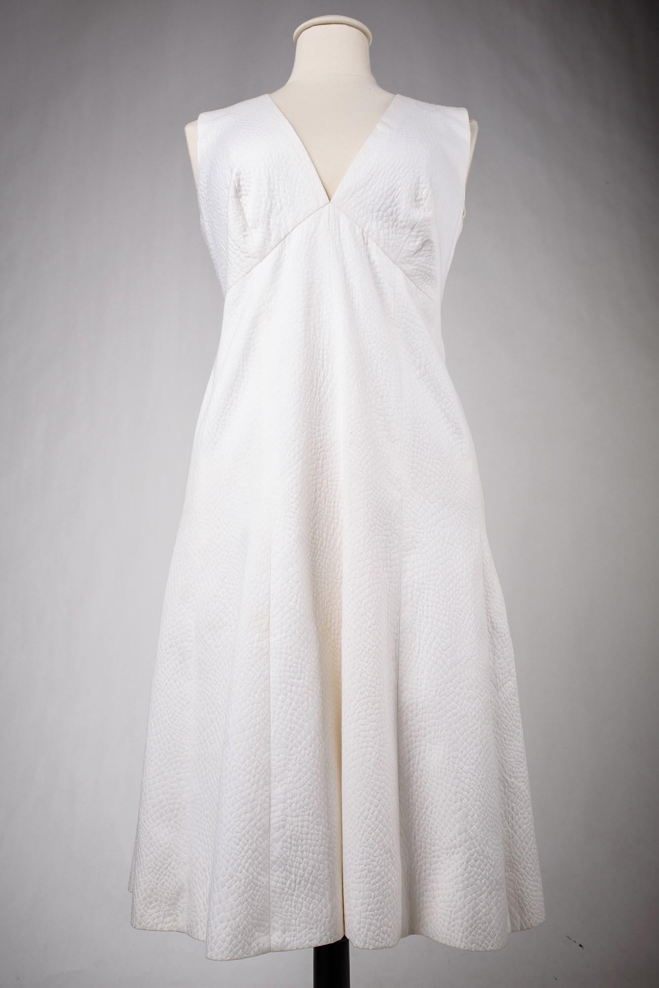 A Chanel Couture white cotton Set numbered 59989/59990 Circa 1970 8