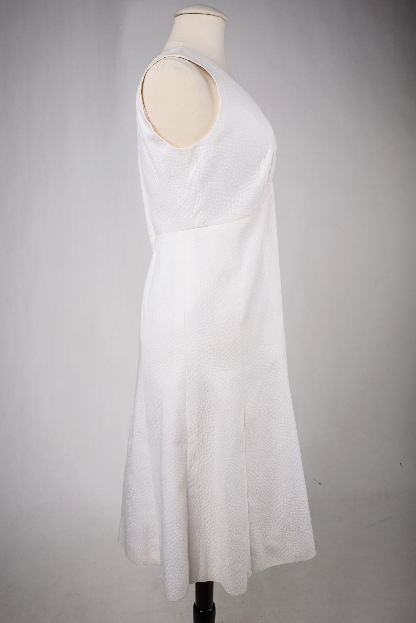 A Chanel Couture white cotton Set numbered 59989/59990 Circa 1970 9