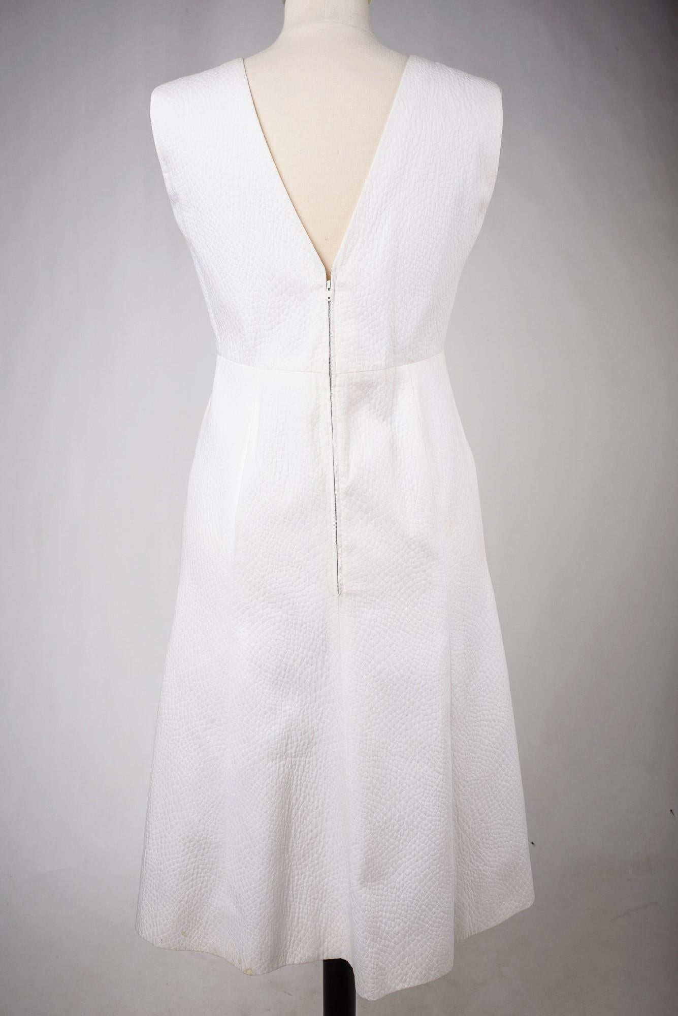A Chanel Couture white cotton Set numbered 59989/59990 Circa 1970 10