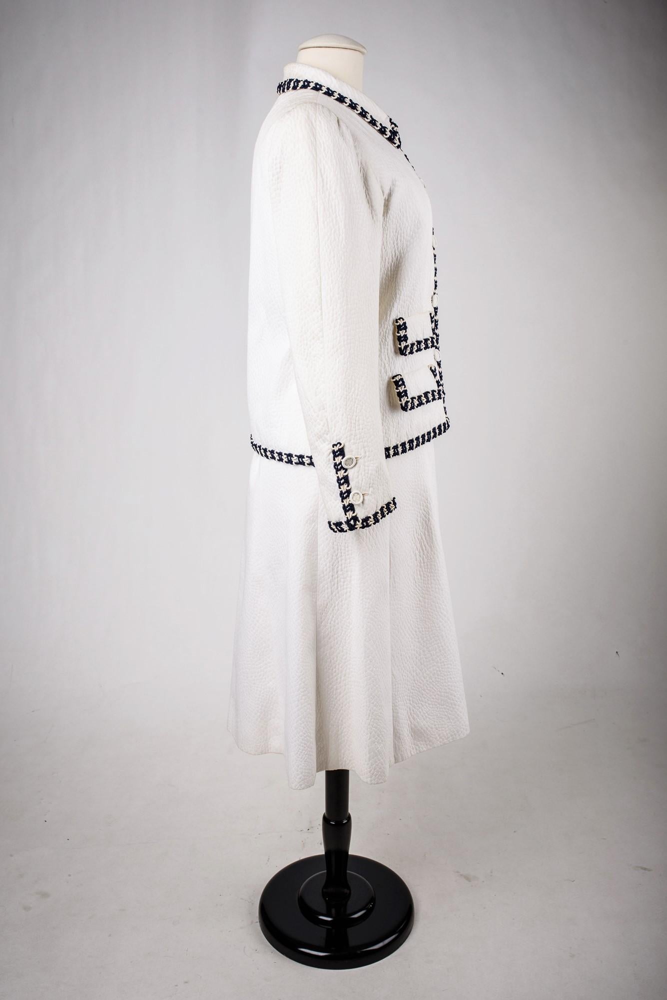 A Chanel Couture white cotton Set numbered 59989/59990 Circa 1970 3