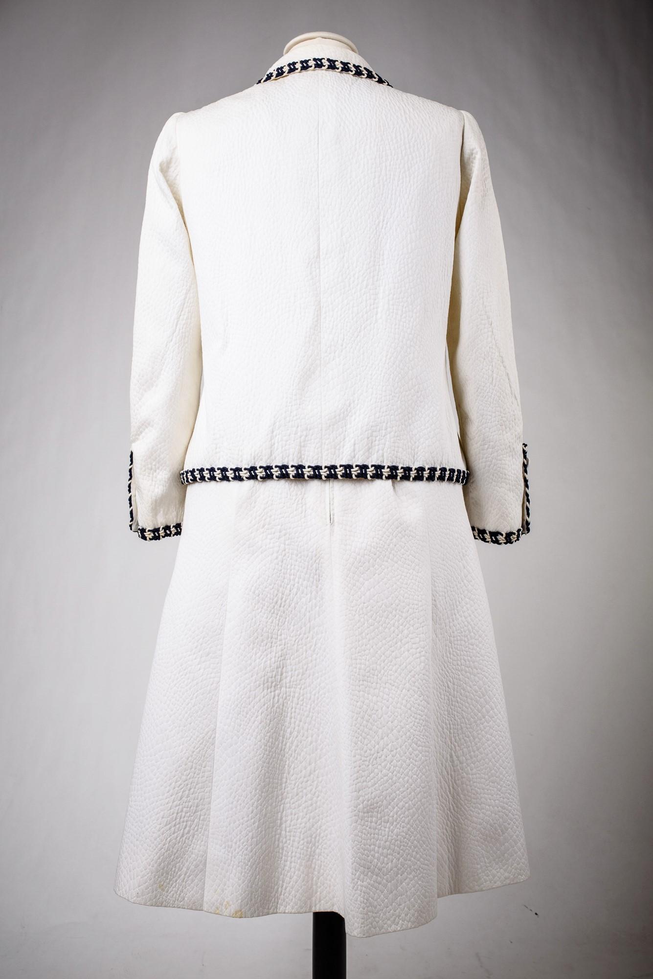 A Chanel Couture white cotton Set numbered 59989/59990 Circa 1970 5