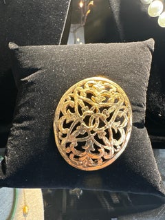 A Chanel Goldtone Filigree Brooch, 2 x 1.75.