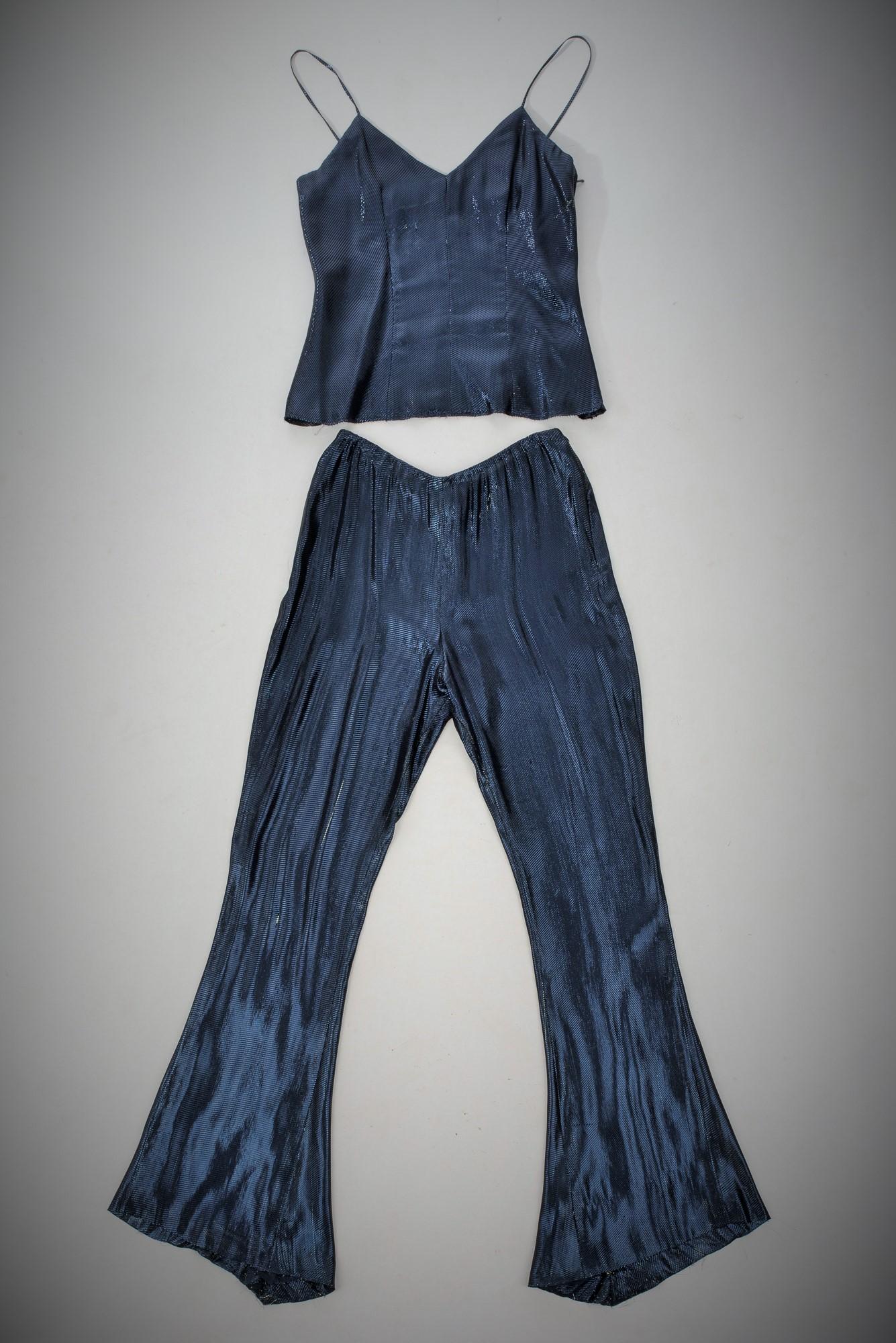 A Chanel Haute Couture Evening Lamé Pyjamas and Woollen Coat Circa Numbered 1980 1