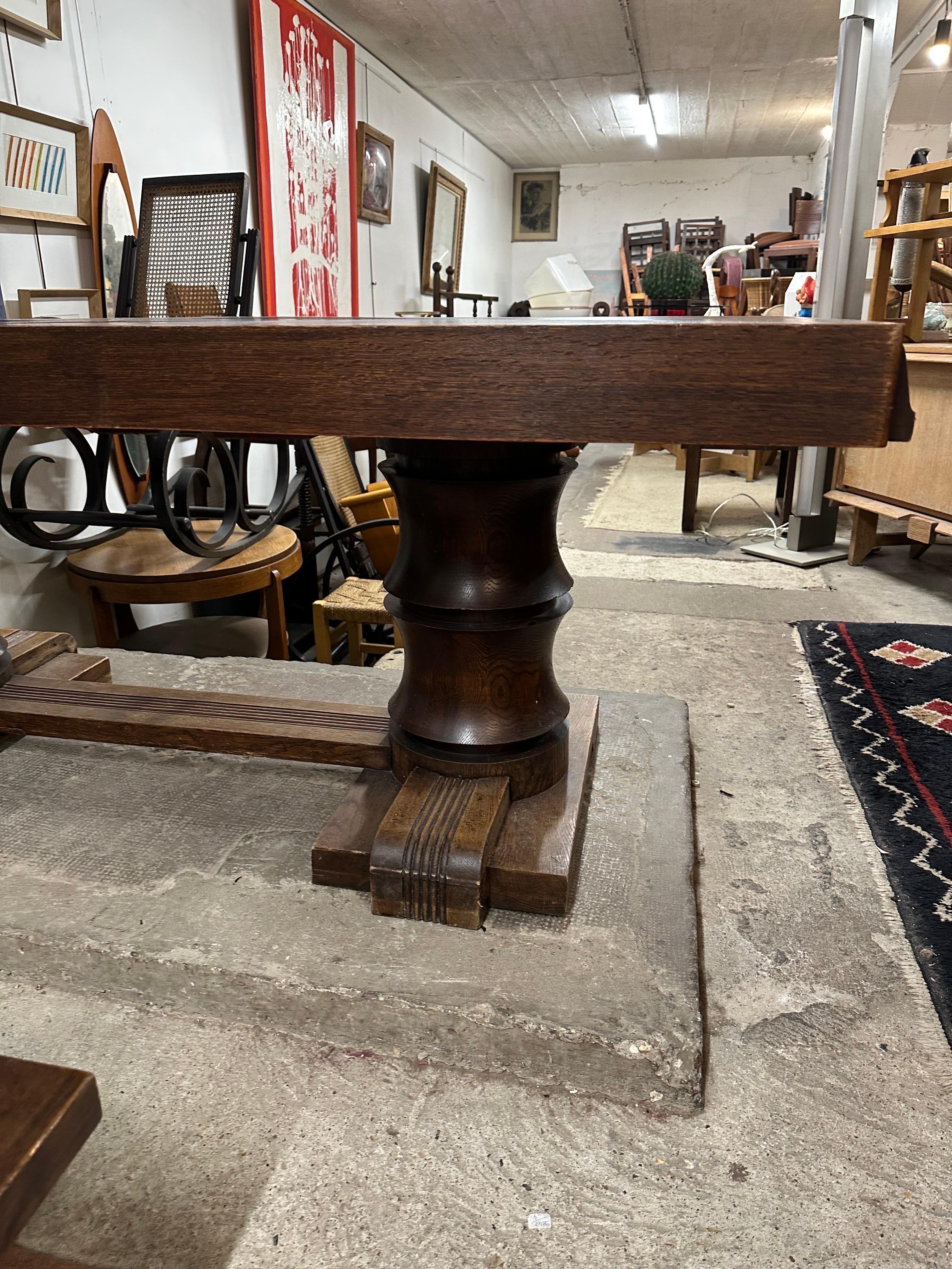 A dining table in oak by Charles can get 2 leaves on each sides.