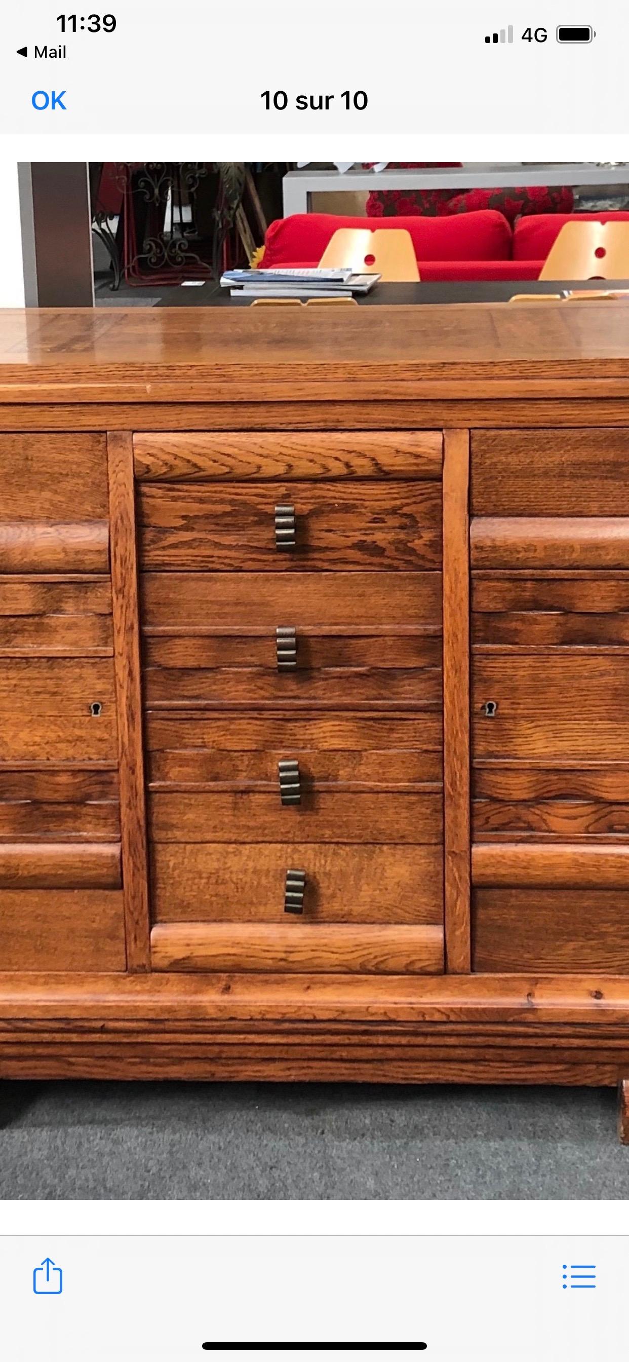 An oak sideboard by Charles Dudouyt.