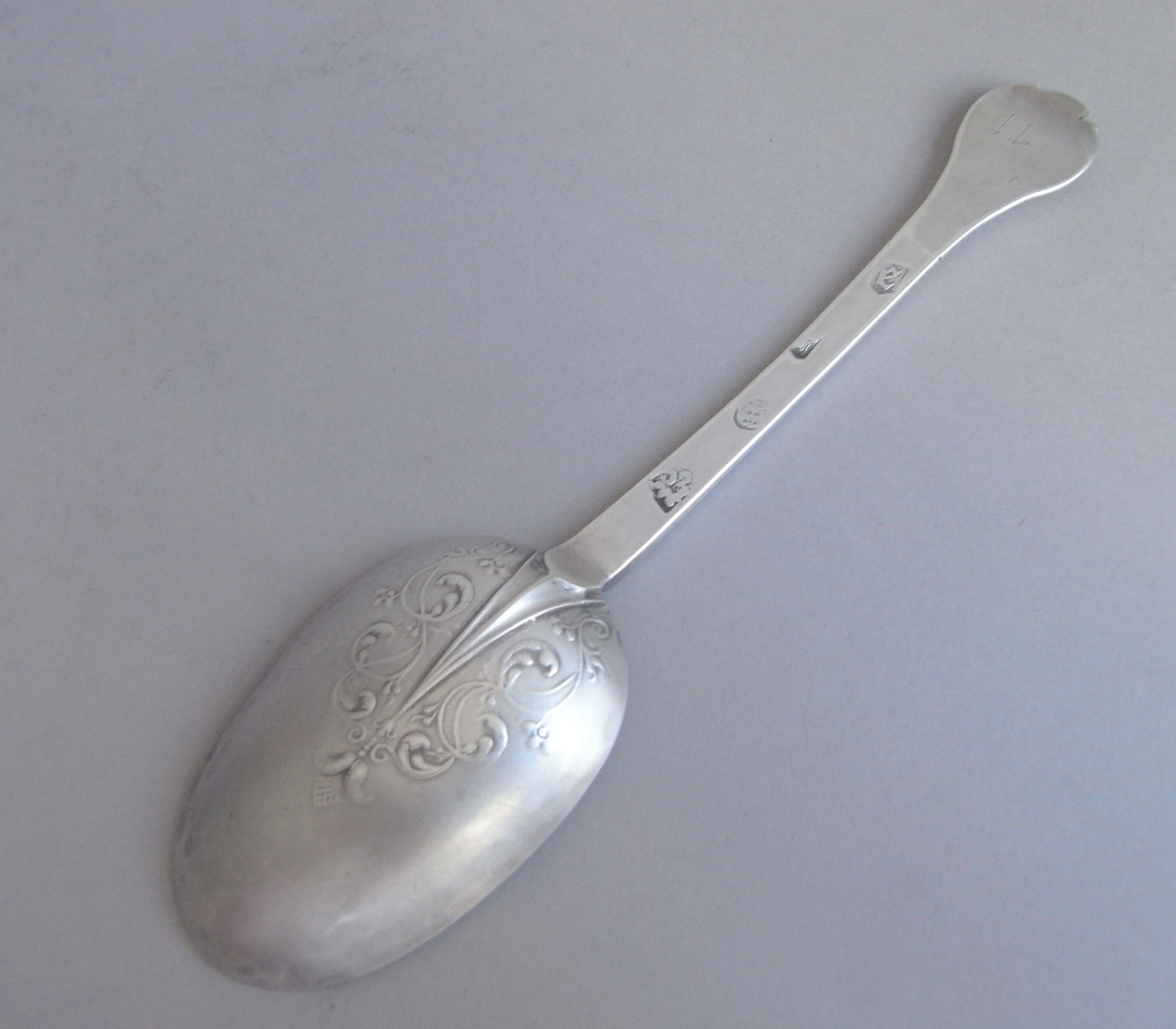 Thisvery rare antique sterling silver Spoon is modelled in the Trefid style and the back of the bowl displays finely detailed scroll lace work entwined with beaded bands, around a raised reeded rat tail. The back of the stem displays a good set of