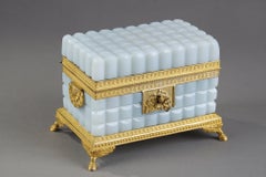 A Charles X opaline casket with its perfume bottles