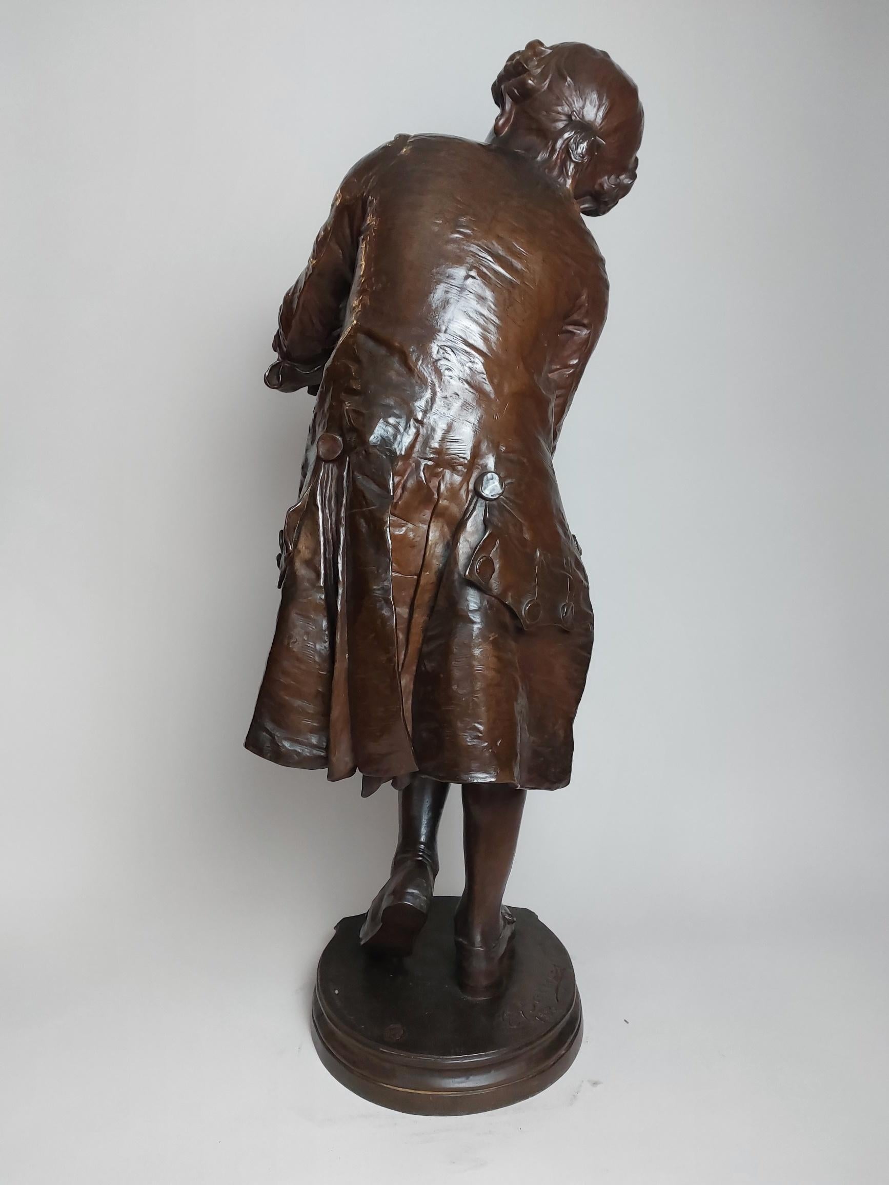 A charming 19th century French bronze of the Young Mozart tuning his violin on his knee.

This is a very popular bronze with many versions in various sizes cast, this is particularly good casting in a large size.
The same model of bronze in the