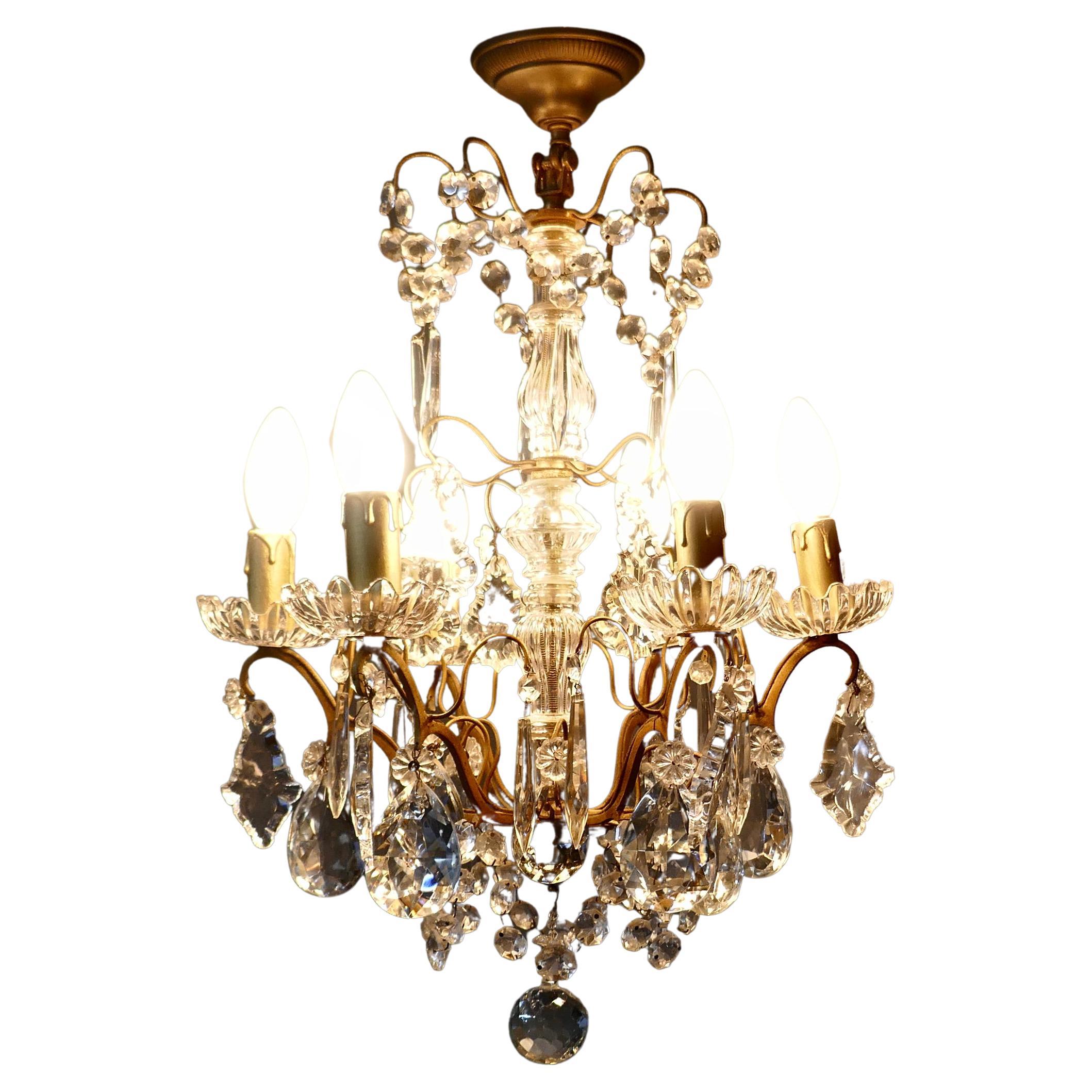 Charming French Crystal 6 Branch Brass Chandelier