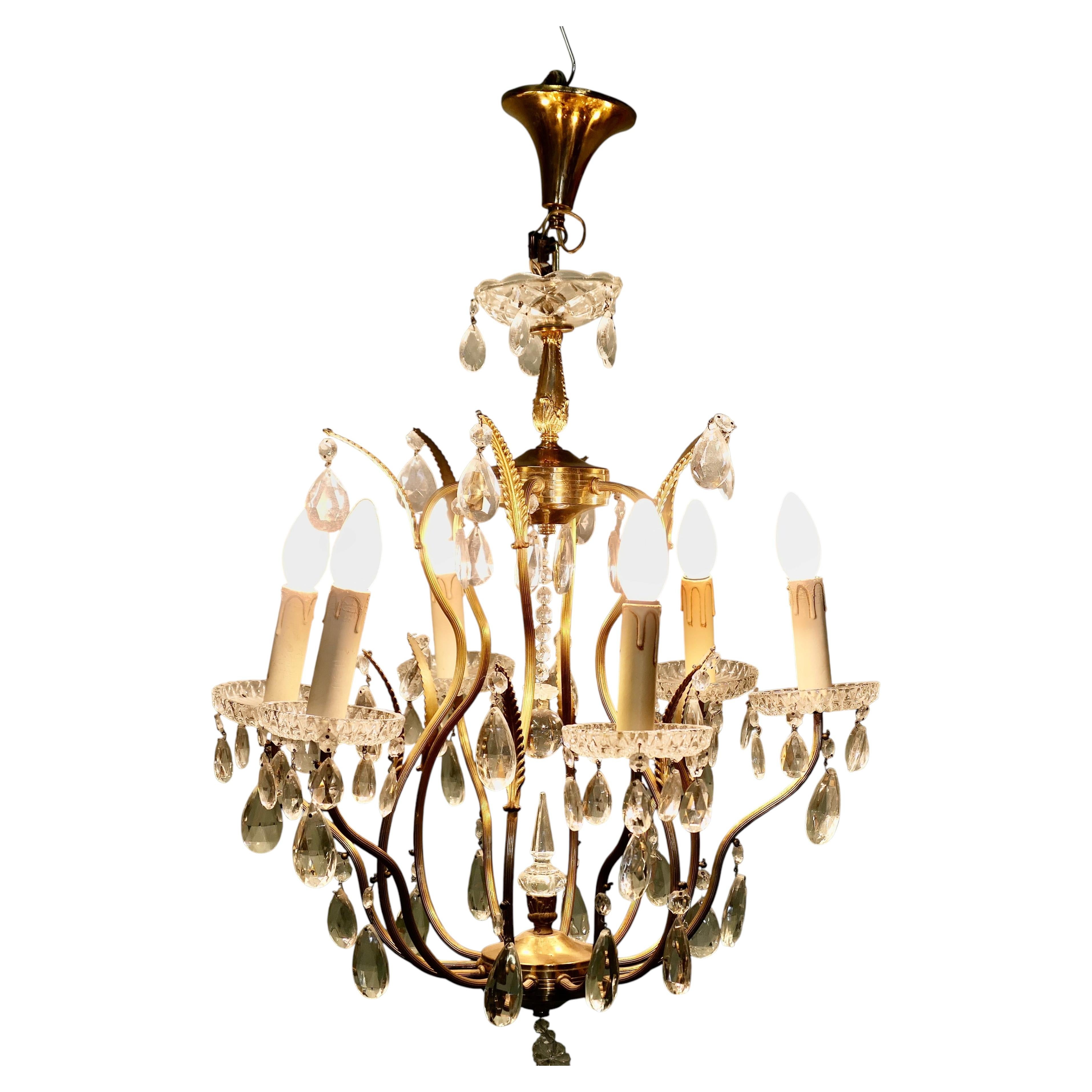 A Charming French Crystal and Brass Chandelier For Sale