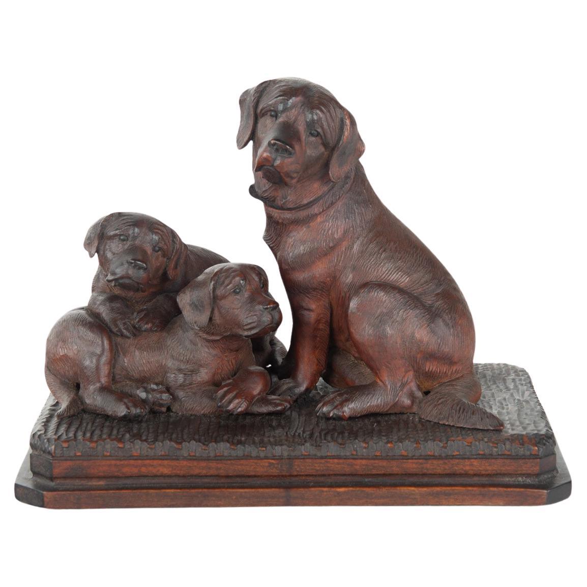 A charming late 19th century Black Forest carved limewood (linden wood) group