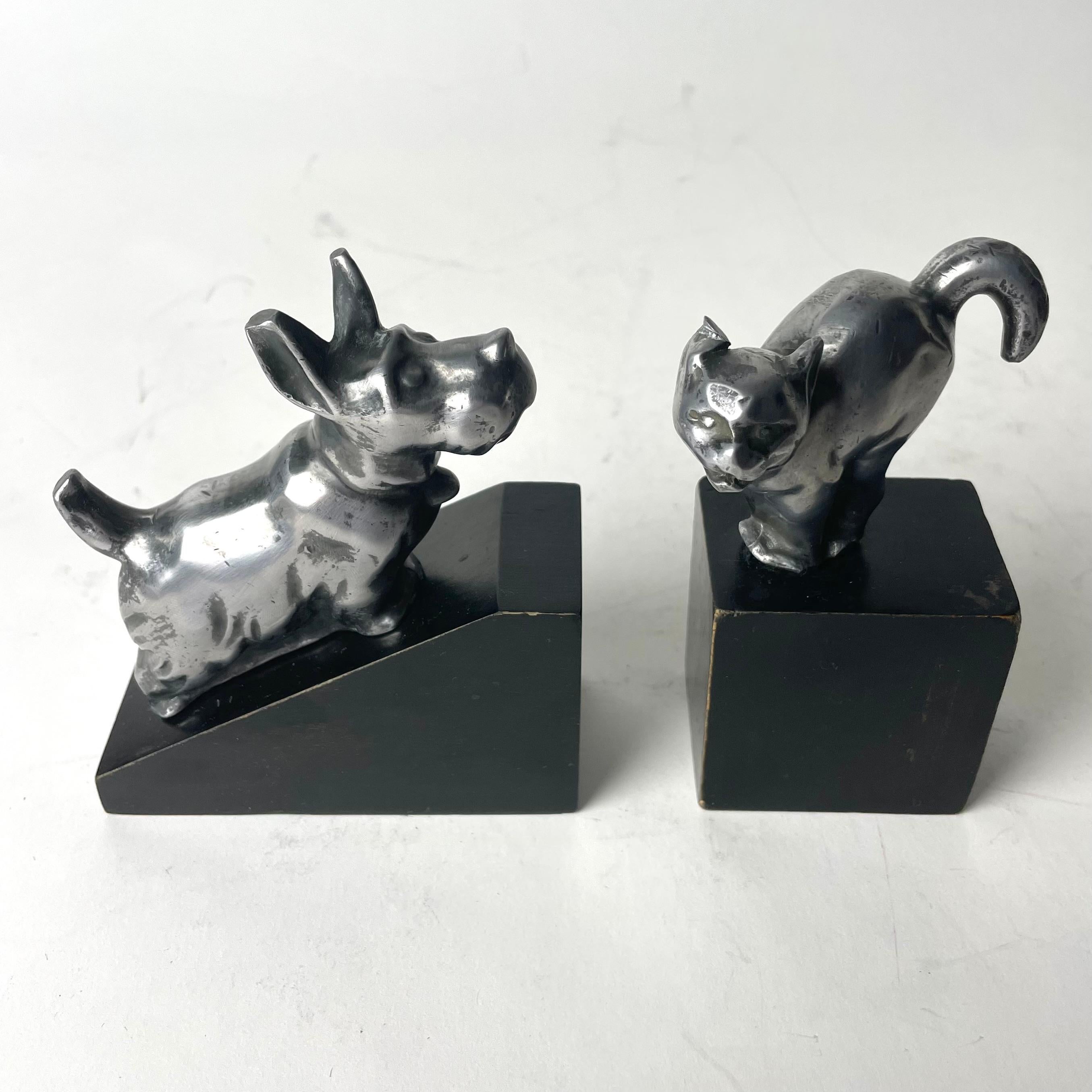 Swedish A charming pair of Art Deco Bookends with a dog and a cat from the 1920s-1930s