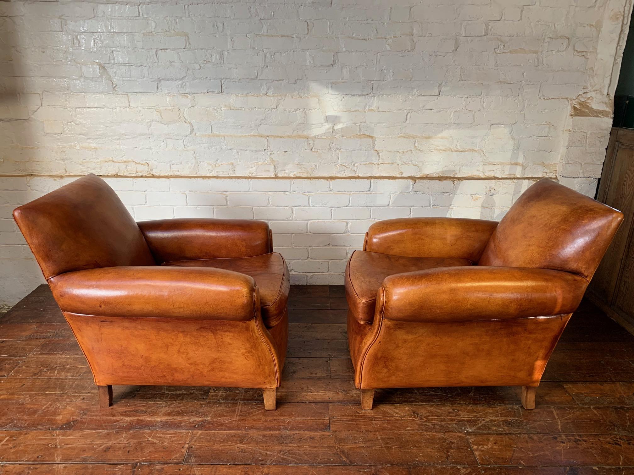 A Charming Pair of English Leather Club Chairs Circa 1920’s In Excellent Condition In Hastings, GB