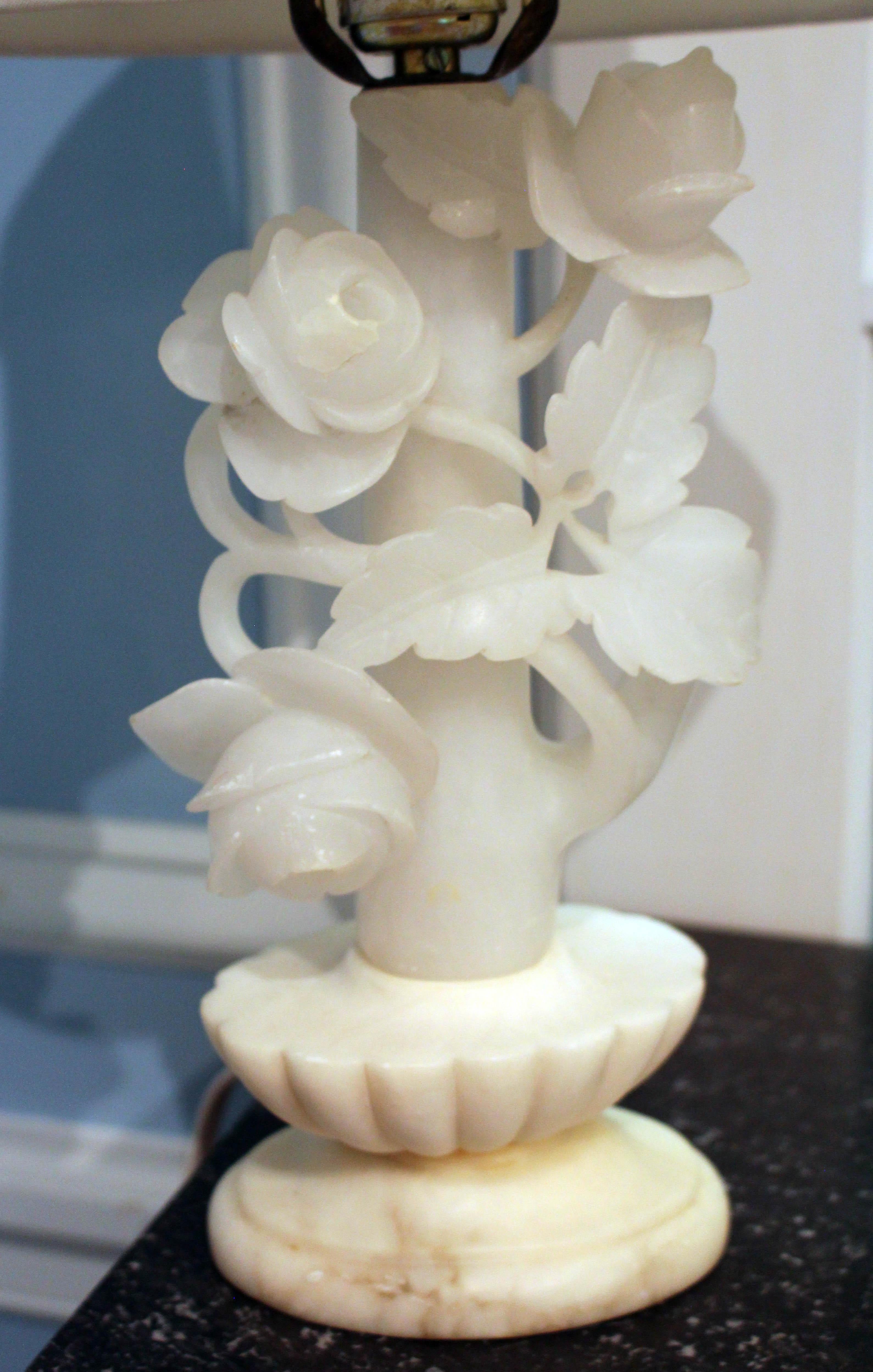 A charming rose carved alabaster lamp - from an oval classical base emerge an entwined 
