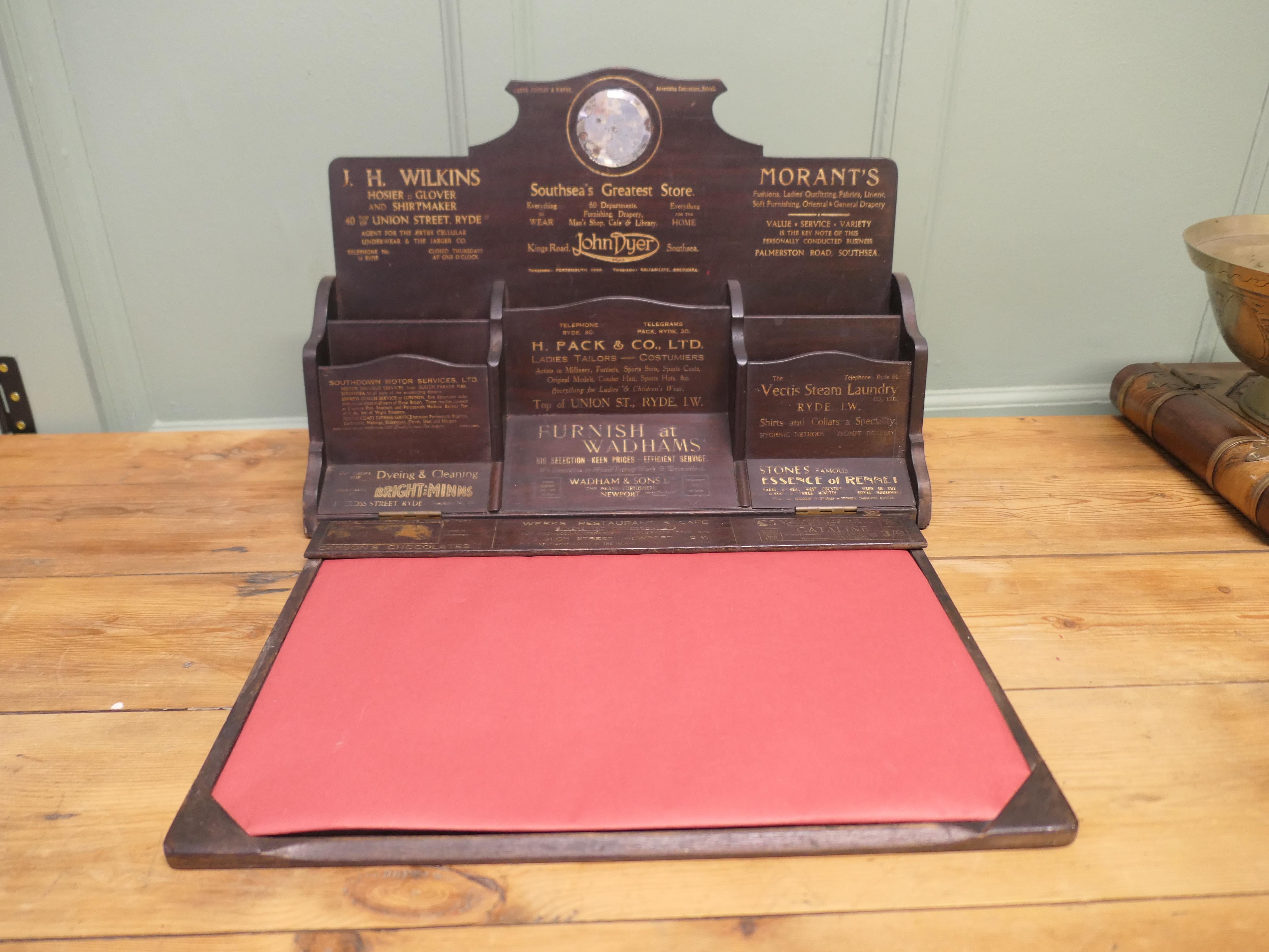 A Charming Victorian Postcard or Stationary Stand, South Coast

This is a very attractive piece, the box is made walnut and is sign written with local advertisements 
The cabinet has several storage sections for leaflets postcards etc. at the back, 