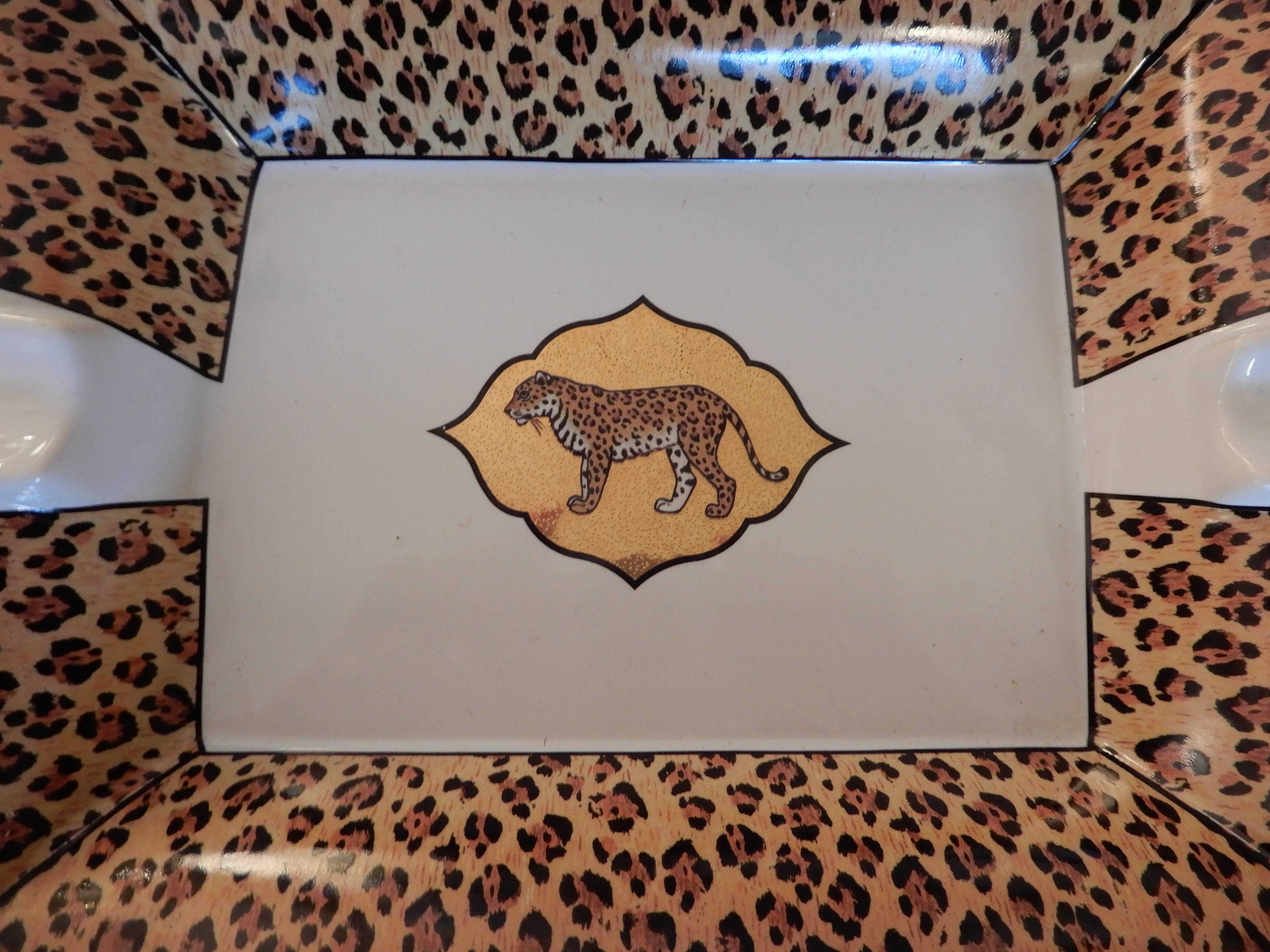 A rare handcrafted chase  ceramic 1990s leopard ashtray, hand-painted and tinted with 24-karat gold.