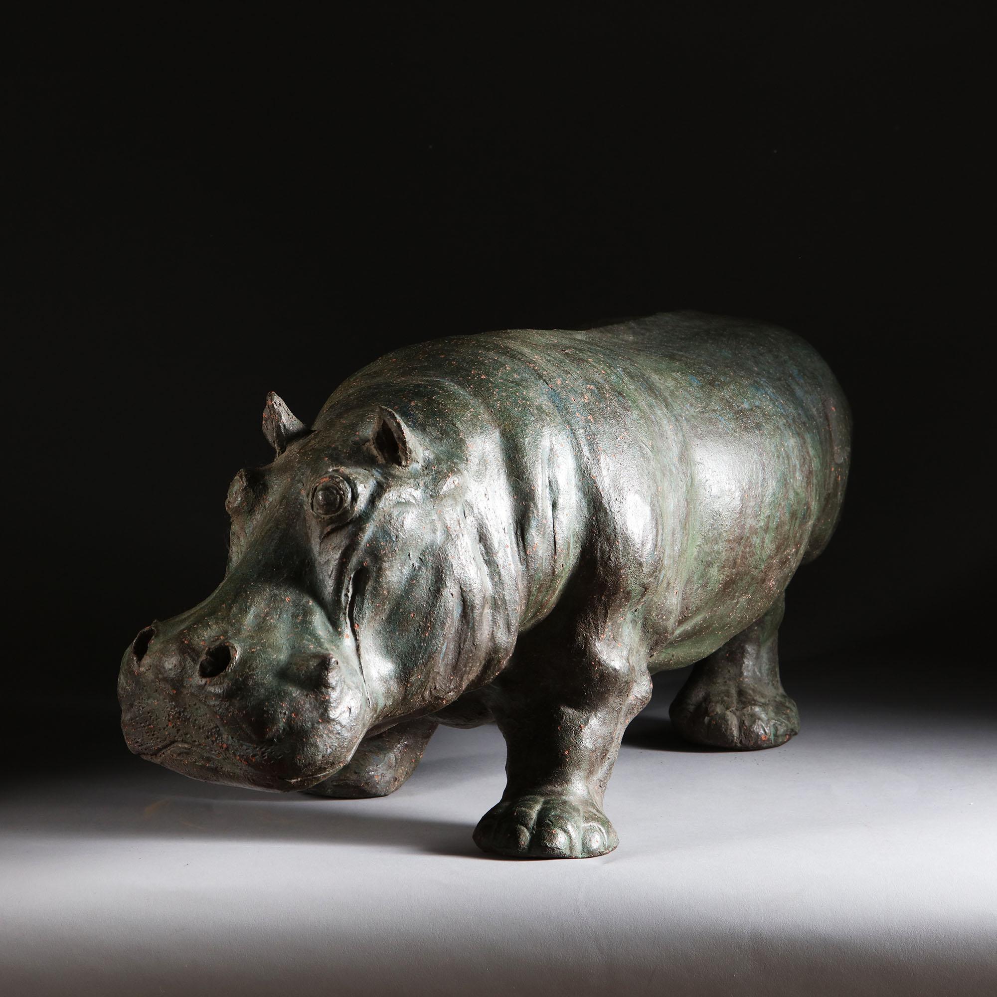 A late 19th century Chinese terracotta model of a hippopotamus, patinated to simulate bronze.