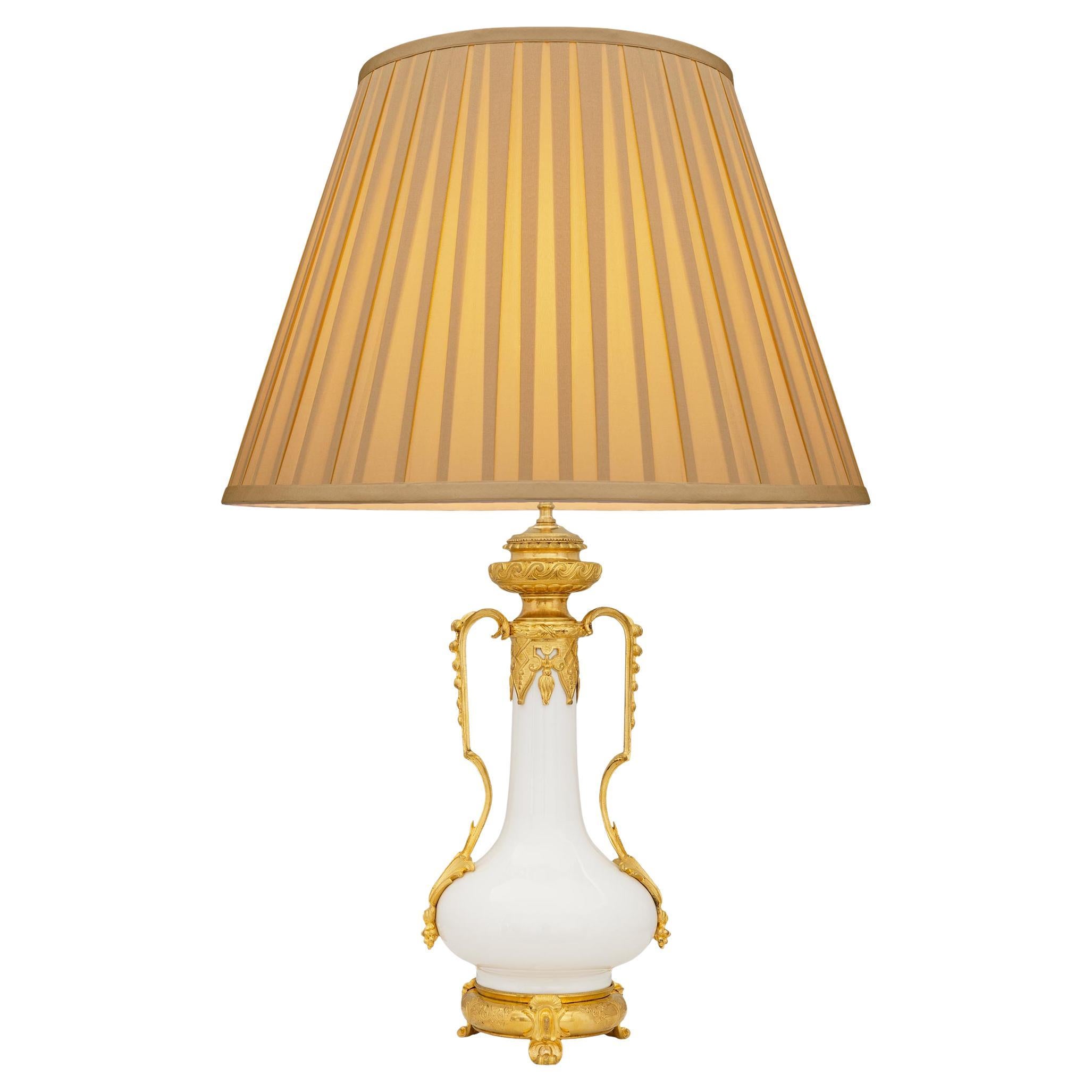 A Chinese Blanc de Chine Porcelain and French 19th century Ormolu mounted lamp For Sale