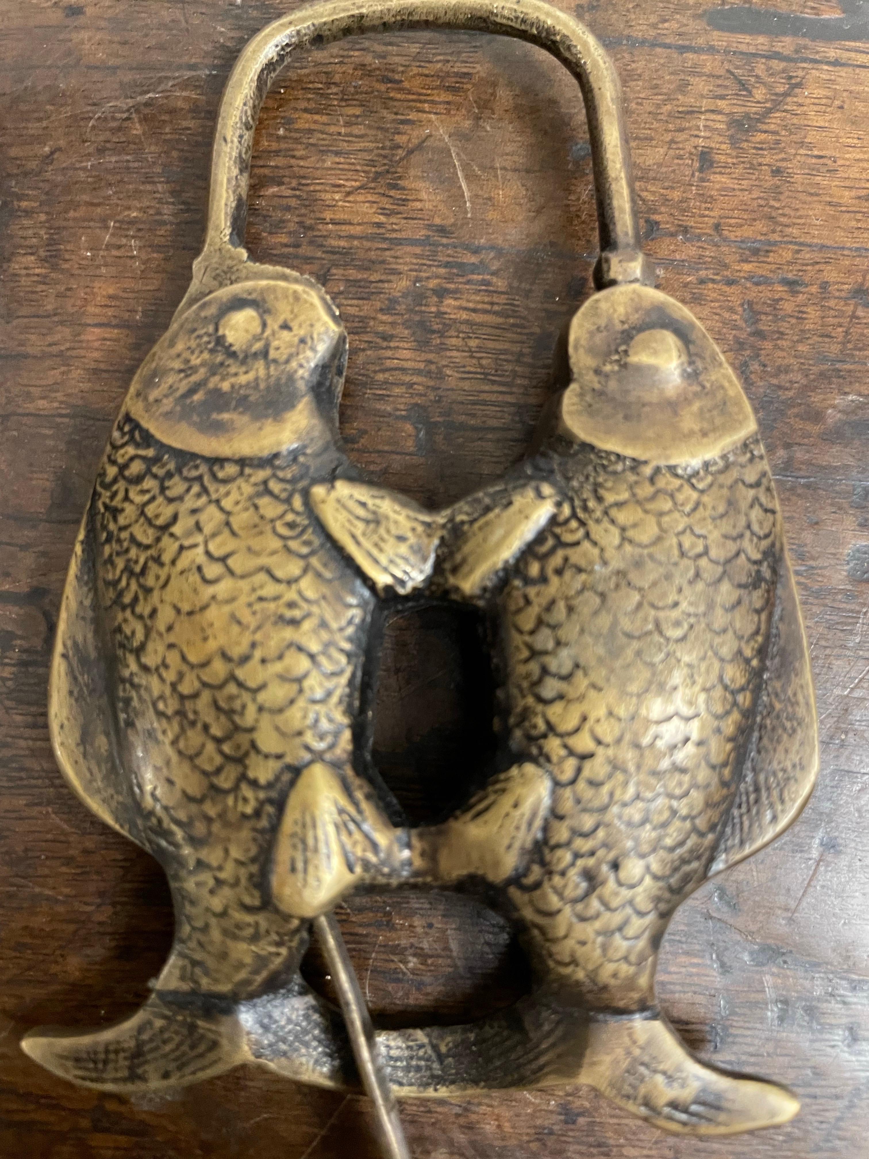 A Chinese Brass Double Fish Shaped Lock with Key, Early 20th Century

Provenance: Private Australian Collection.

Dimension: Width: 13cm Height: 1cm Depth: 7cm.