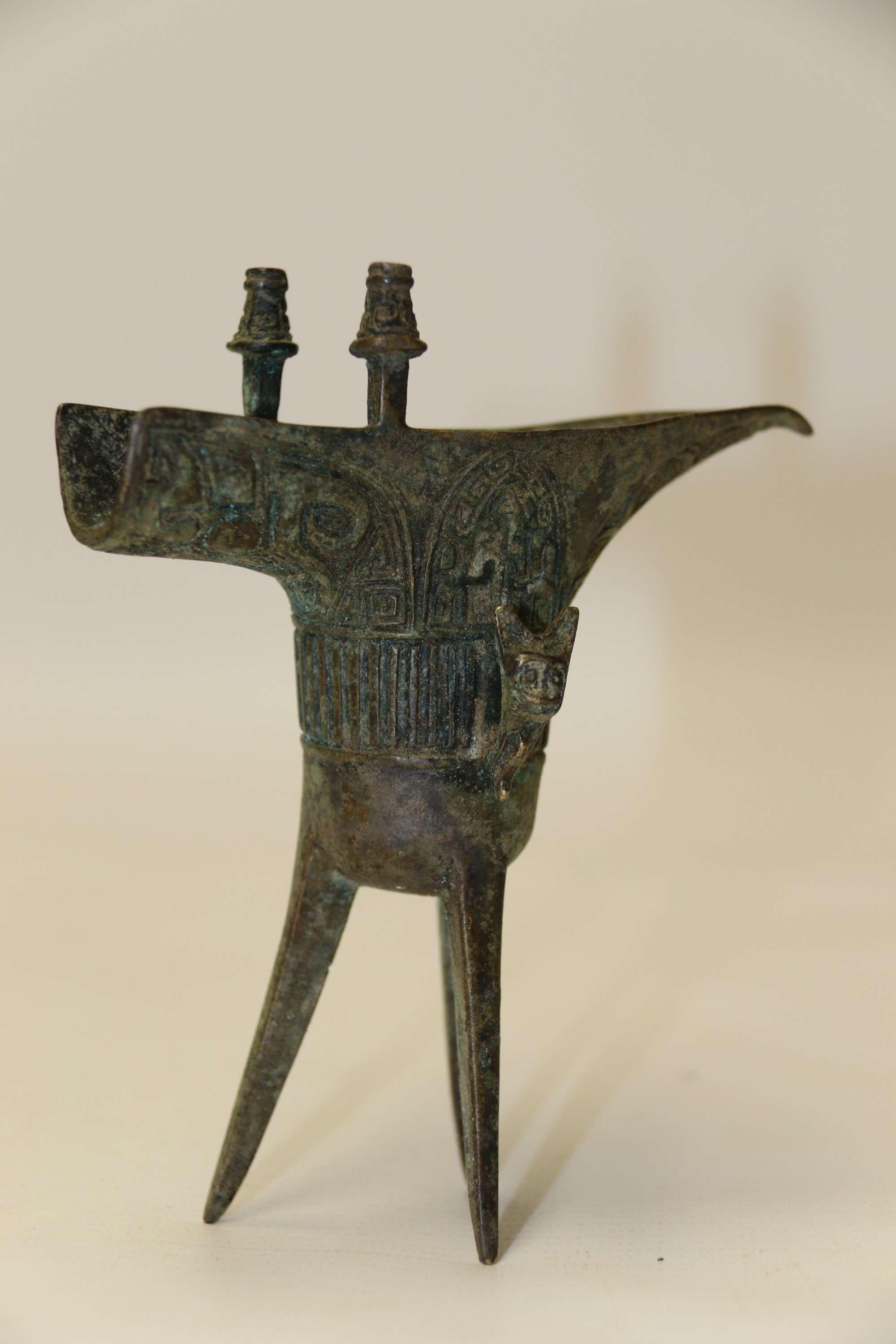 A Fine Chinese Bronze Archaistic Jue Ritual Vessel

This interesting Chinese Archaistic Jue is finely cast in bronze and it represents an ancient pouring vessel used in rituals and ceremonies. This small example is beautifully decorated with a cast