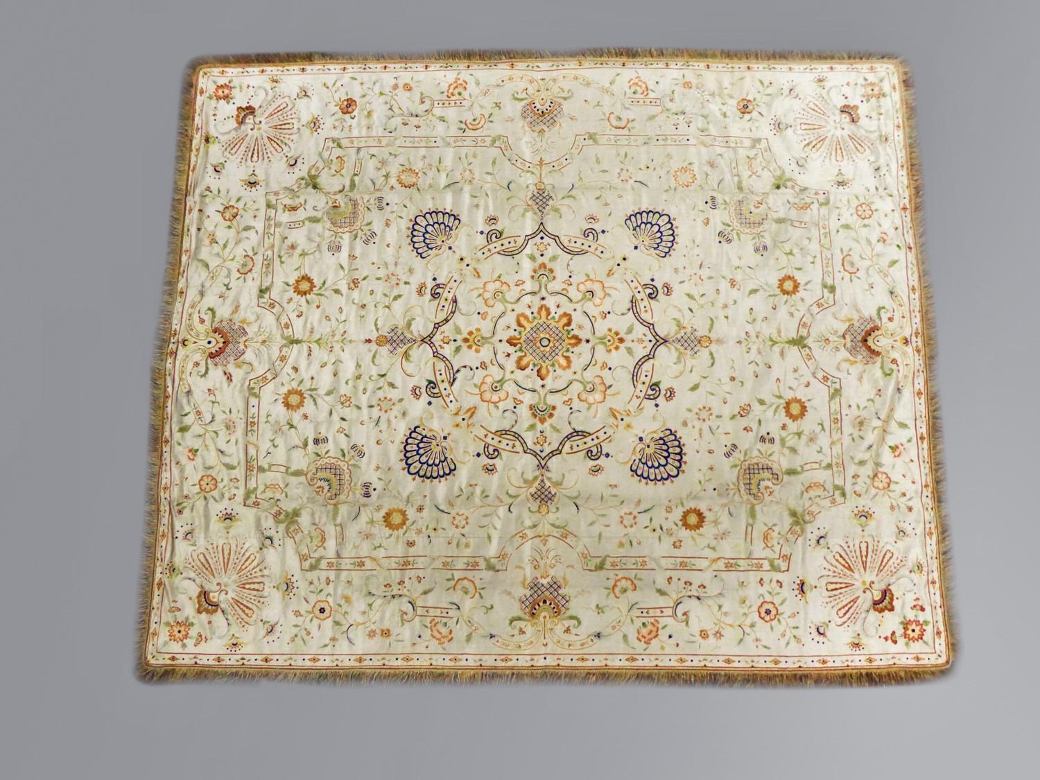 Circa 1780/1810
China for Export in Europe/Portugal

Large bedspread or hanging in cream satin embroidered with polychrome mercerized silk threads. Large orderly and architecturally decorated central medallion and spandrels. Stylized flowered