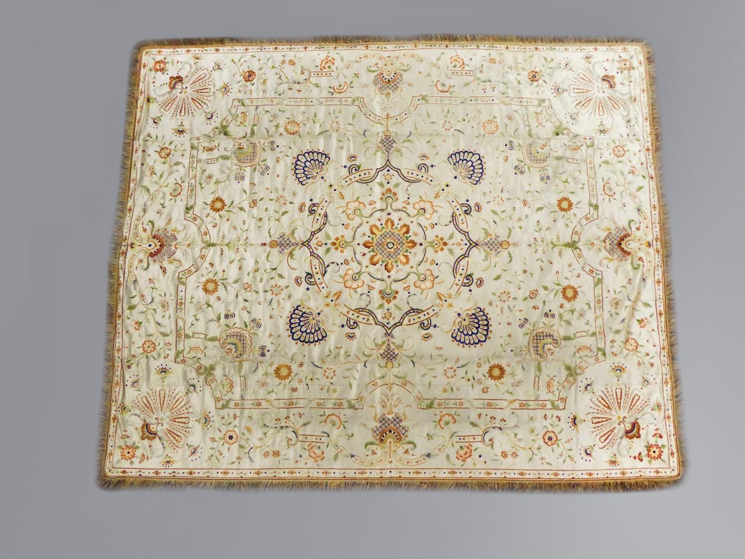 Circa 1780/1810
China for Export in Europe/Portugal
Large bedspread or hanging in cream satin embroidered with polychrome mercerized silk threads. Large orderly and architecturally decorated central medallion and spandrels. Stylized flowered