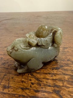 A Chinese Carved Celadon Jade of a Boy with a Buffalo, Early 20th Century
