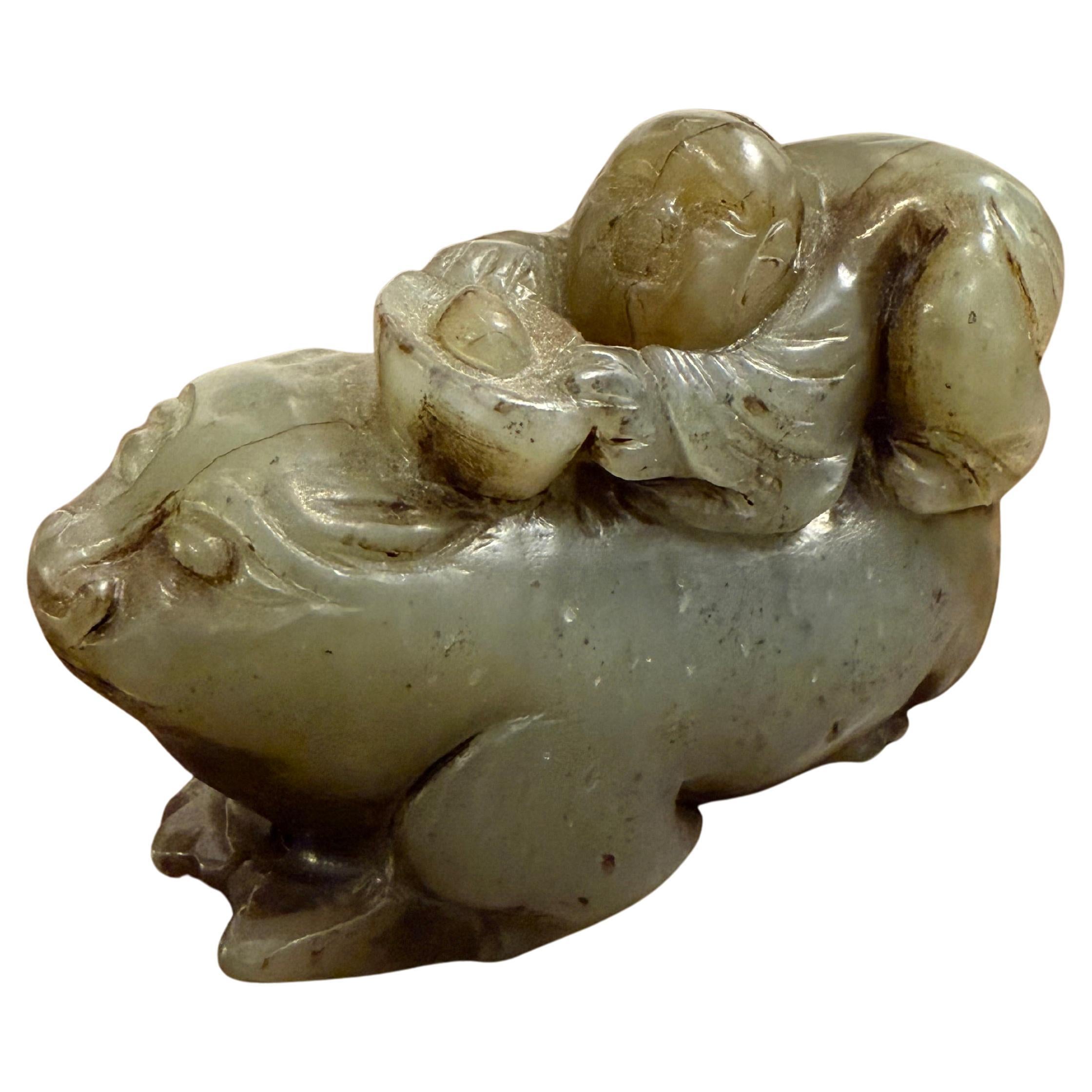 A Chinese Carved Celadon Jade of a Boy with a Buffalo, Early 20th Century in vendita