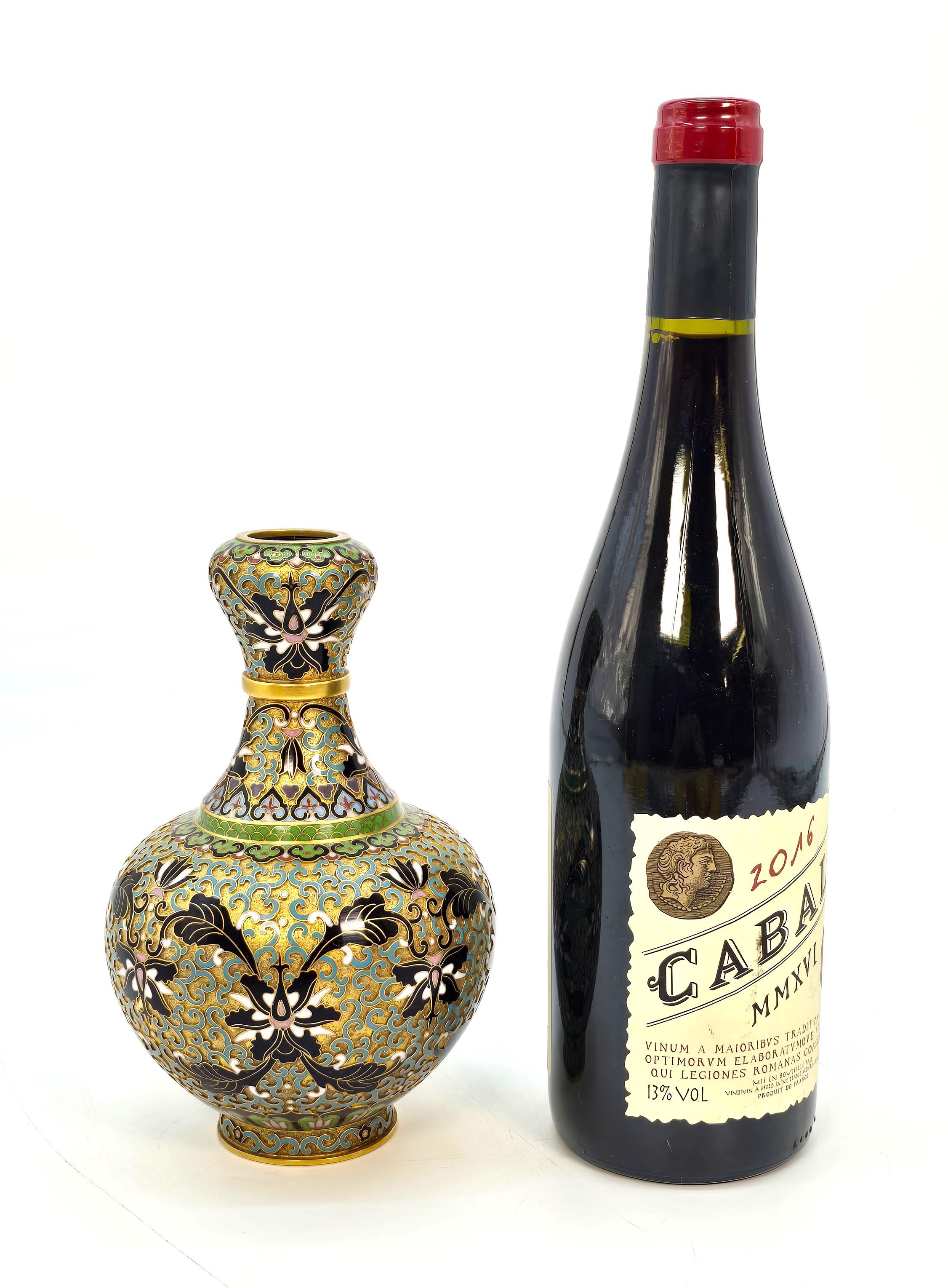 This very fine example of Chinese cloisonné art is beautifully hand decorated onto a gilt metal body, which has been intricately worked with fine wire, which is soldered onto the body in a scrolled and foliate pattern interspersed with exotic