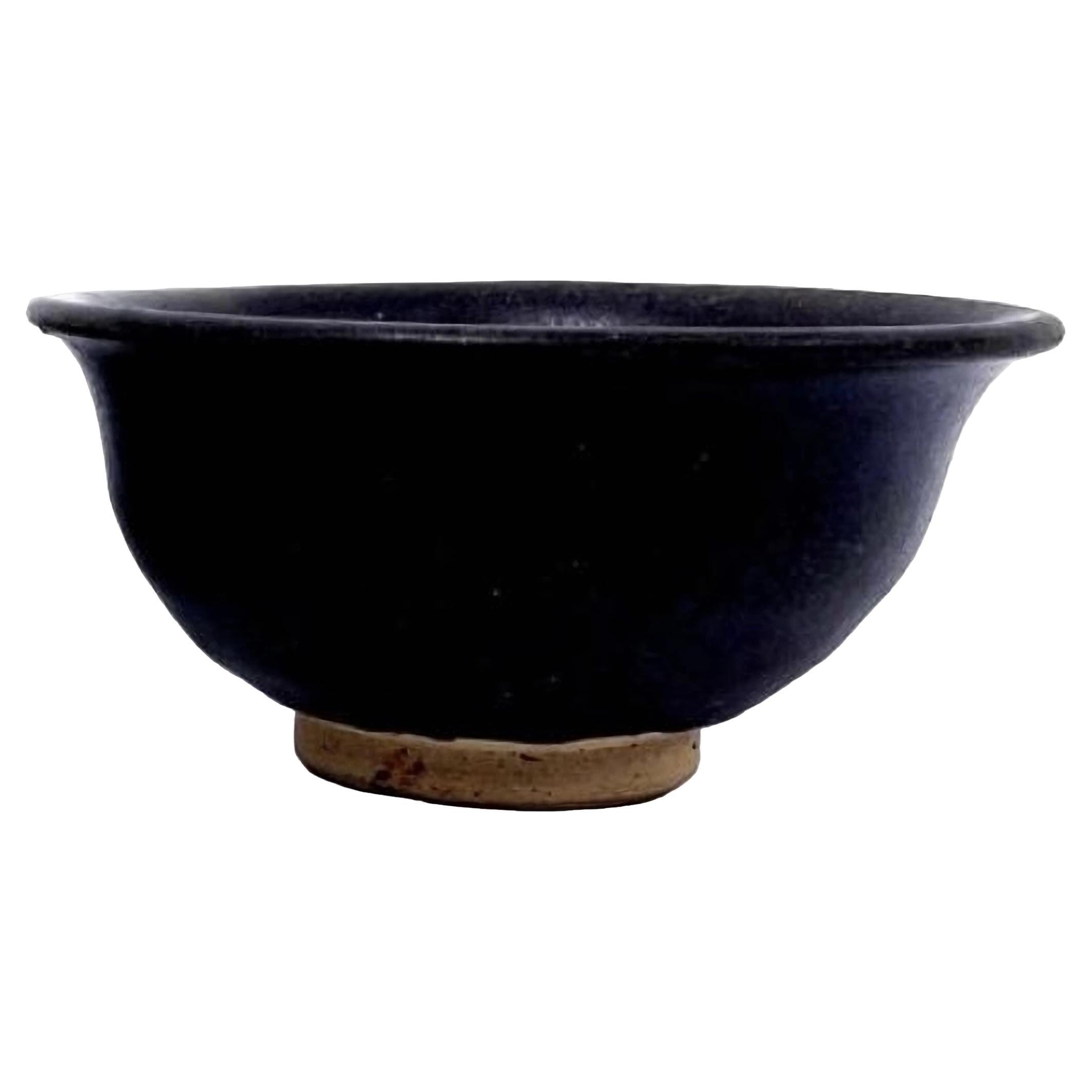 A Chinese Deep Brown Glazed Footed Bowl, 15th Century